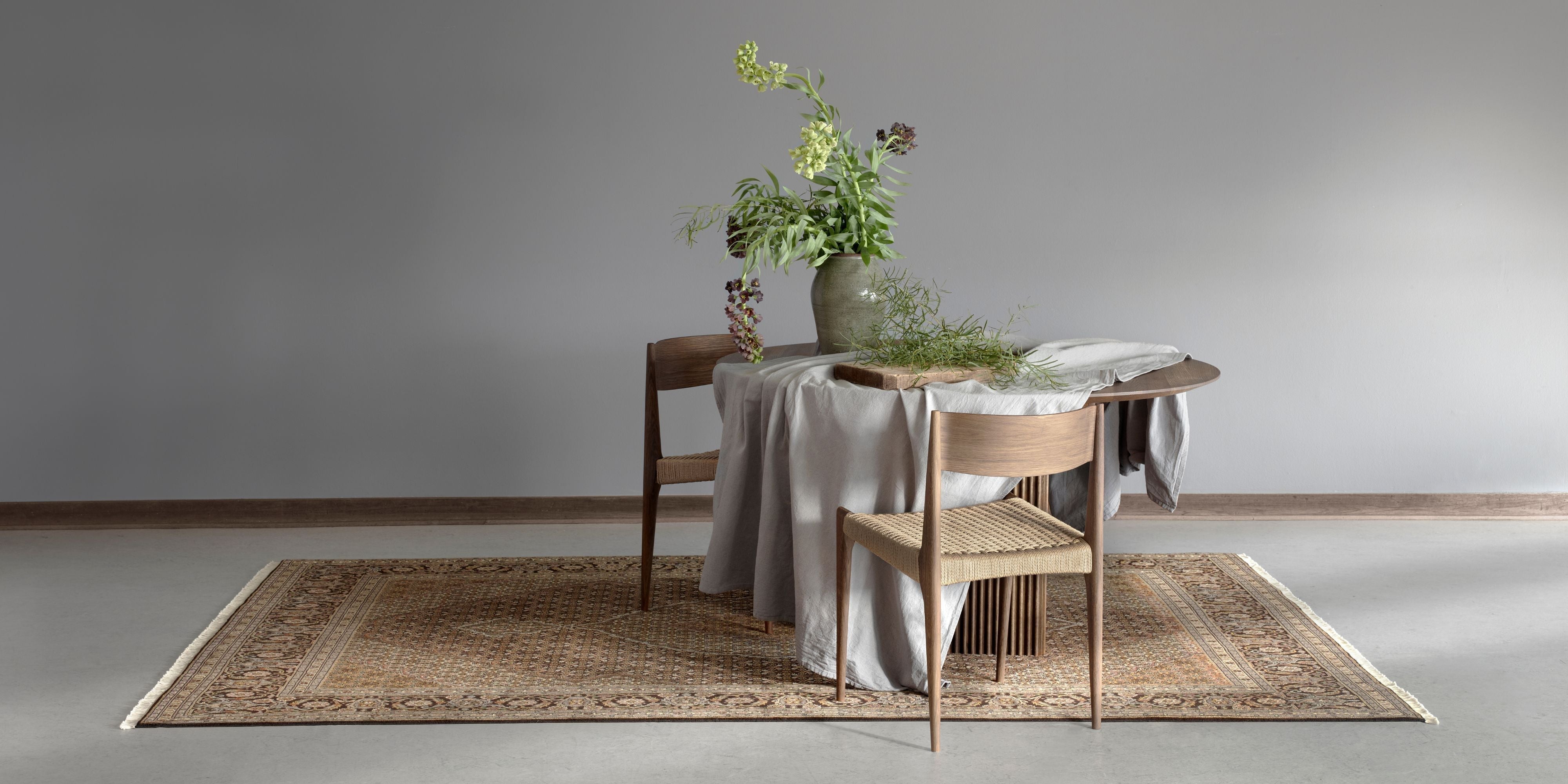 How Big Should a Rug Be under Dining Table: Ultimate Size Guide