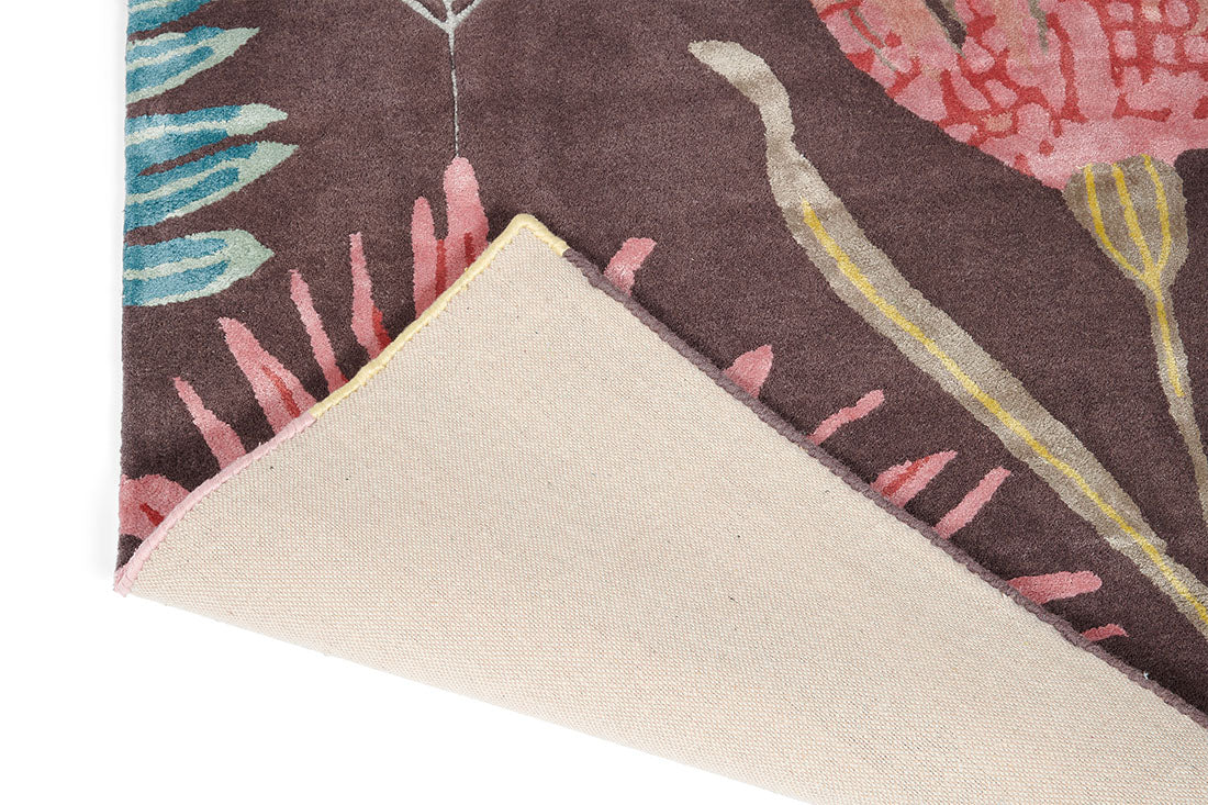Harlequin rug with a multicolour floral pattern