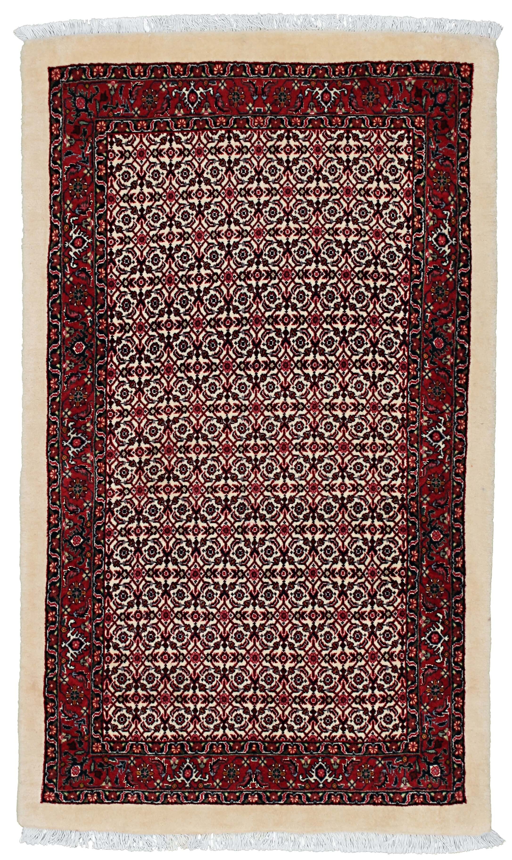 Red and cream persian rug with traditional floral design