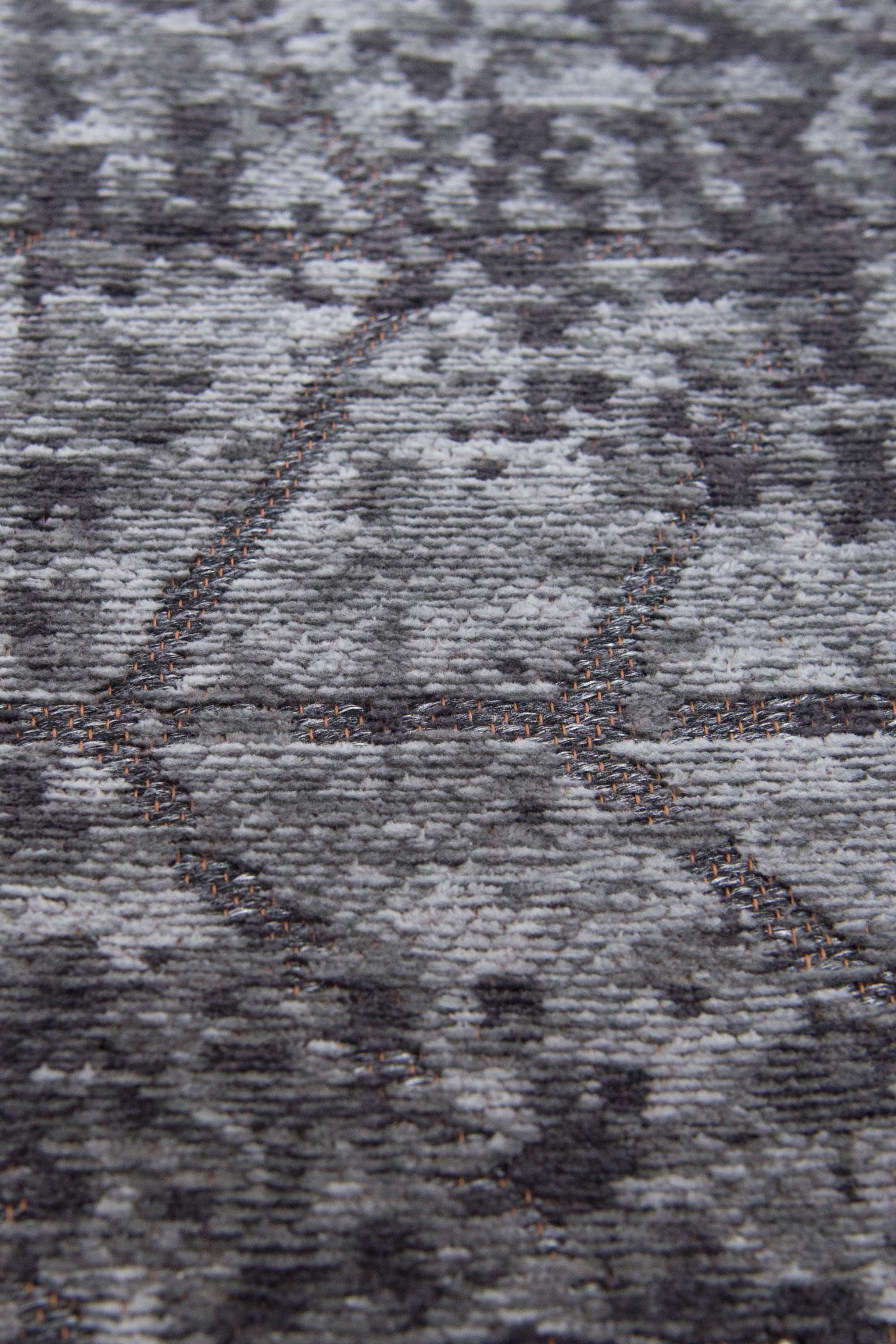 Black flatweave runner rug with faded grey chevron pattern