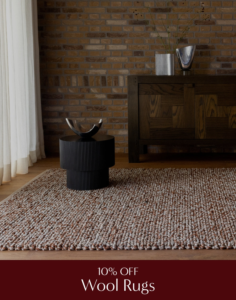 Wool rug in a room with a wooden cabinet and decorative items.