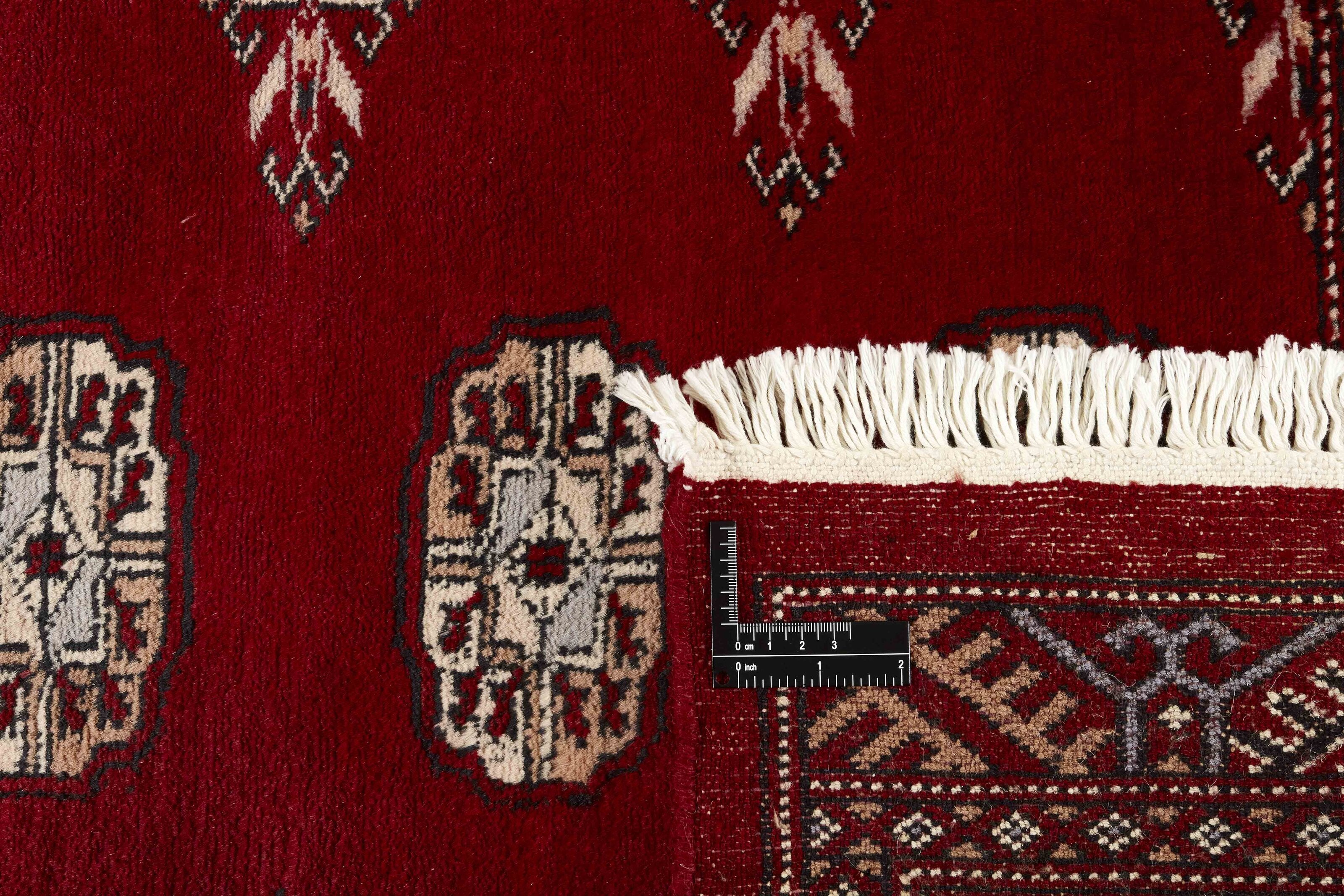 Red Oriental runner with traditional bordered pattern