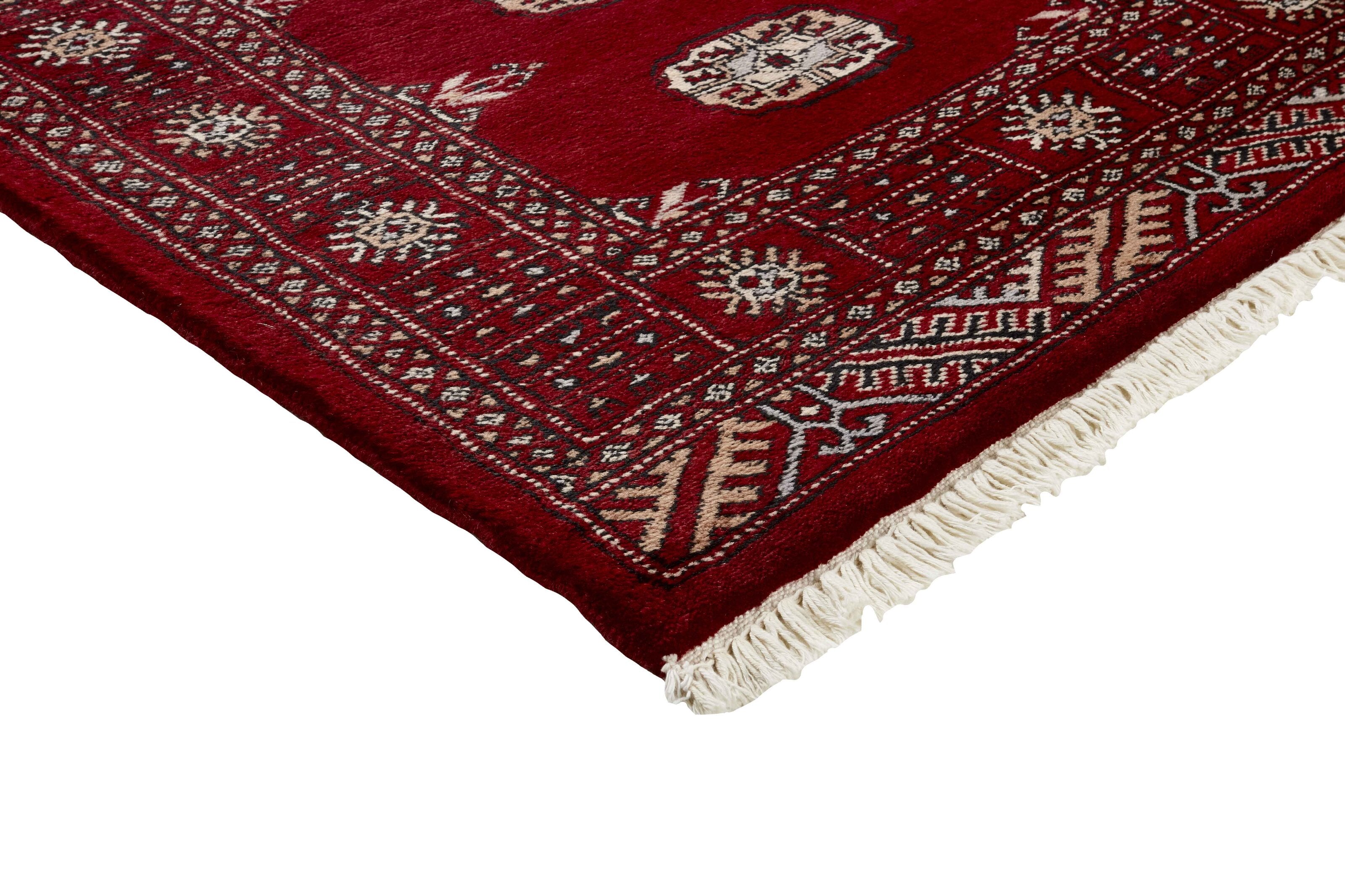 Red Oriental runner with traditional bordered pattern
