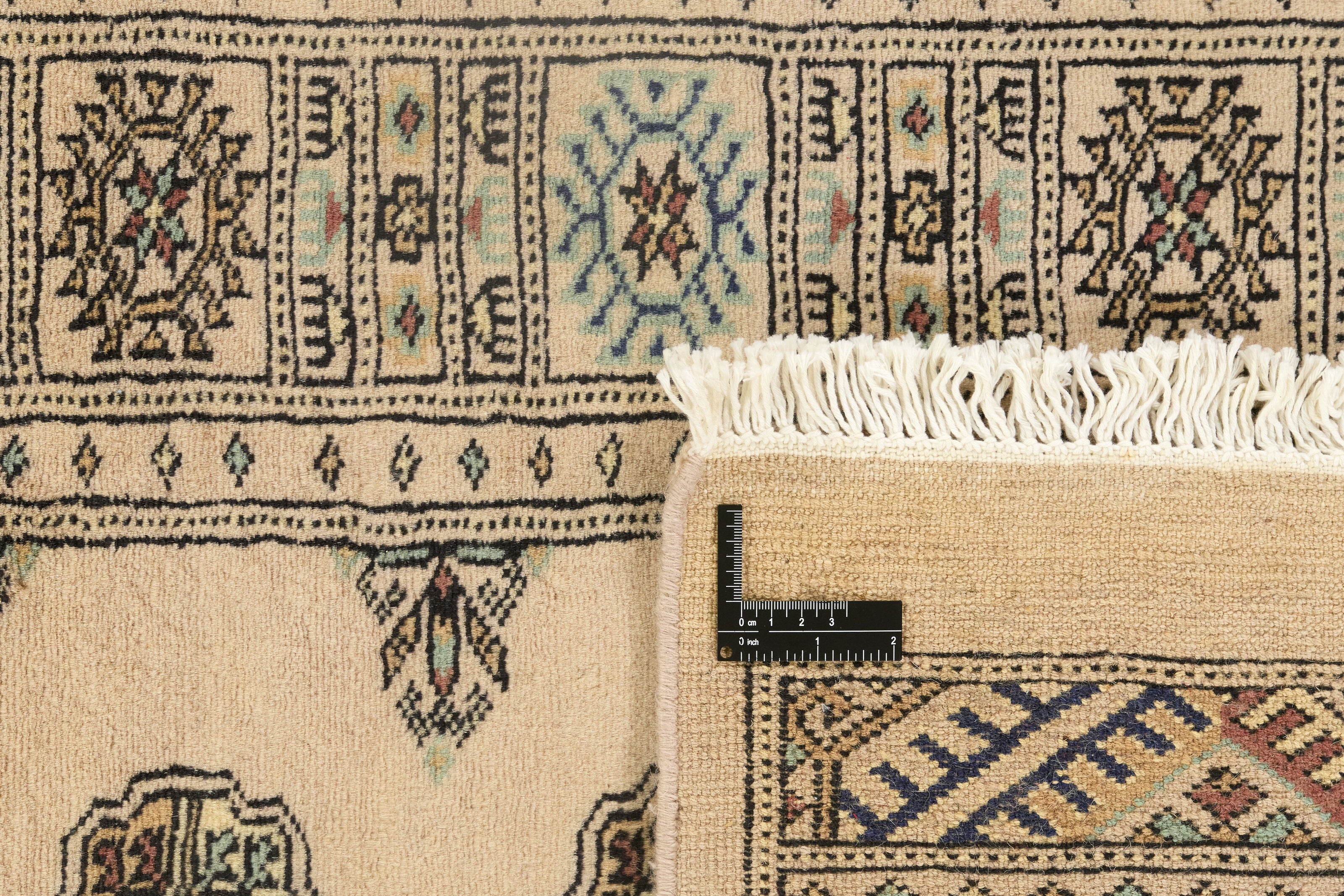 Beige Oriental runner with traditional bordered pattern