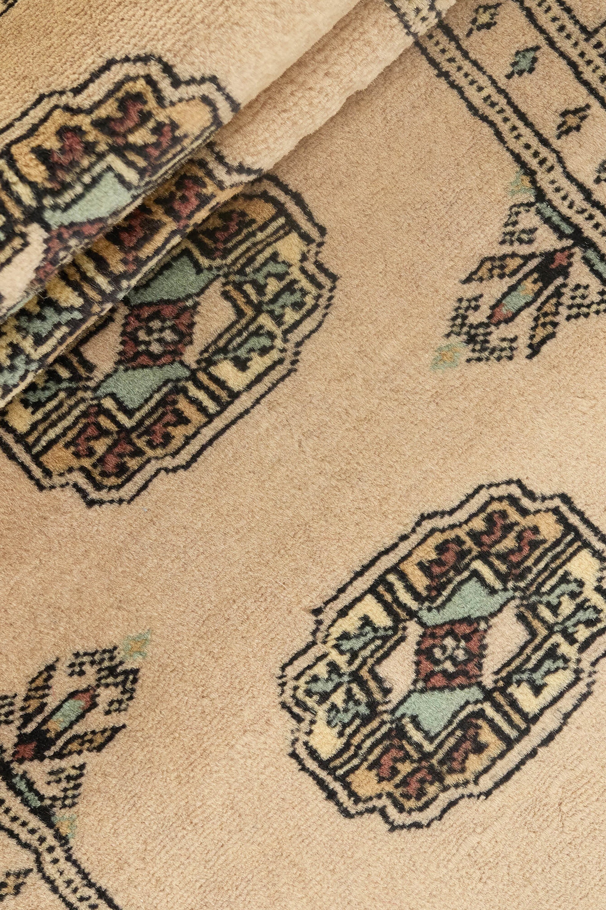 Beige Oriental runner with traditional bordered pattern