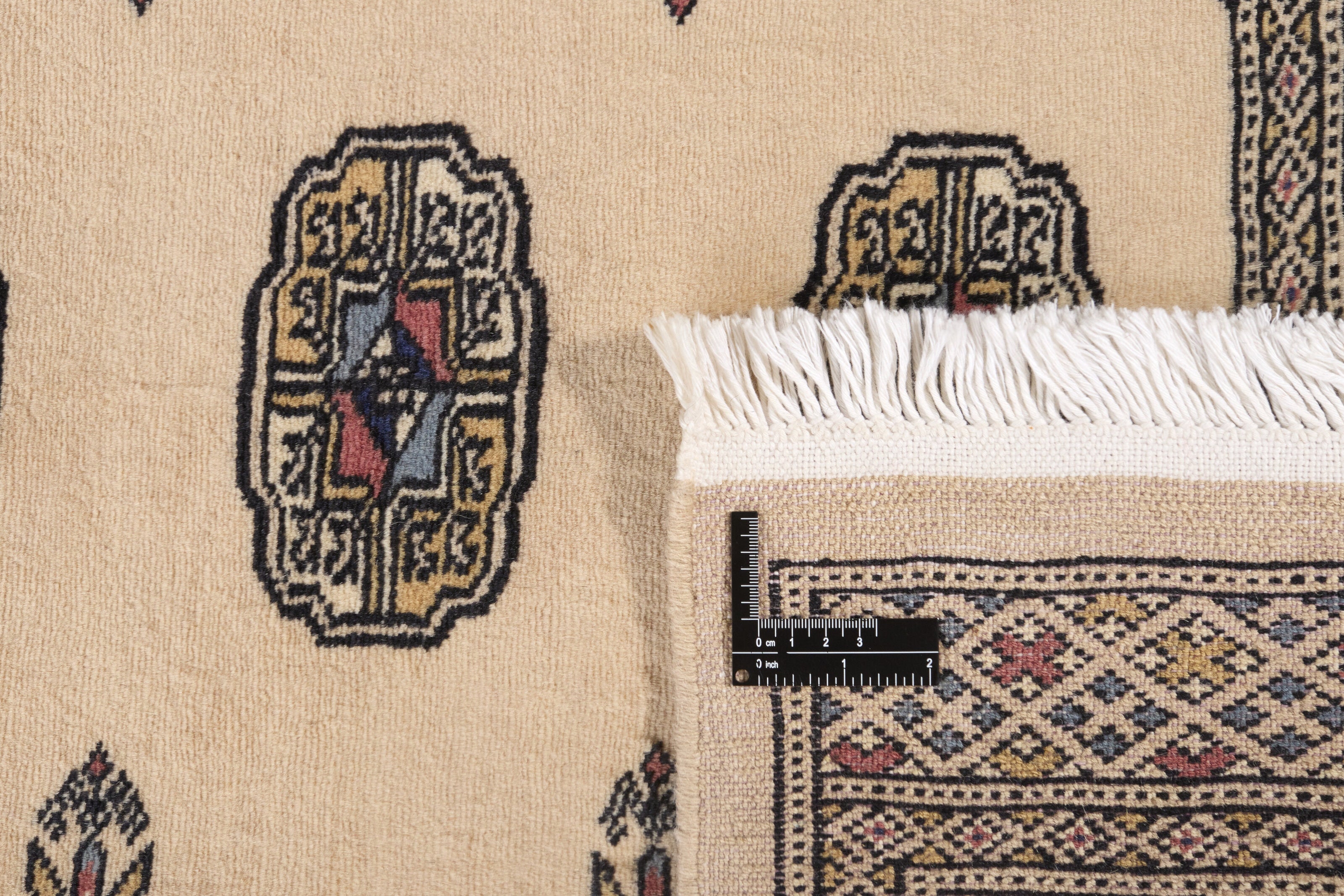 Beige Oriental runner with traditional bordered pattern