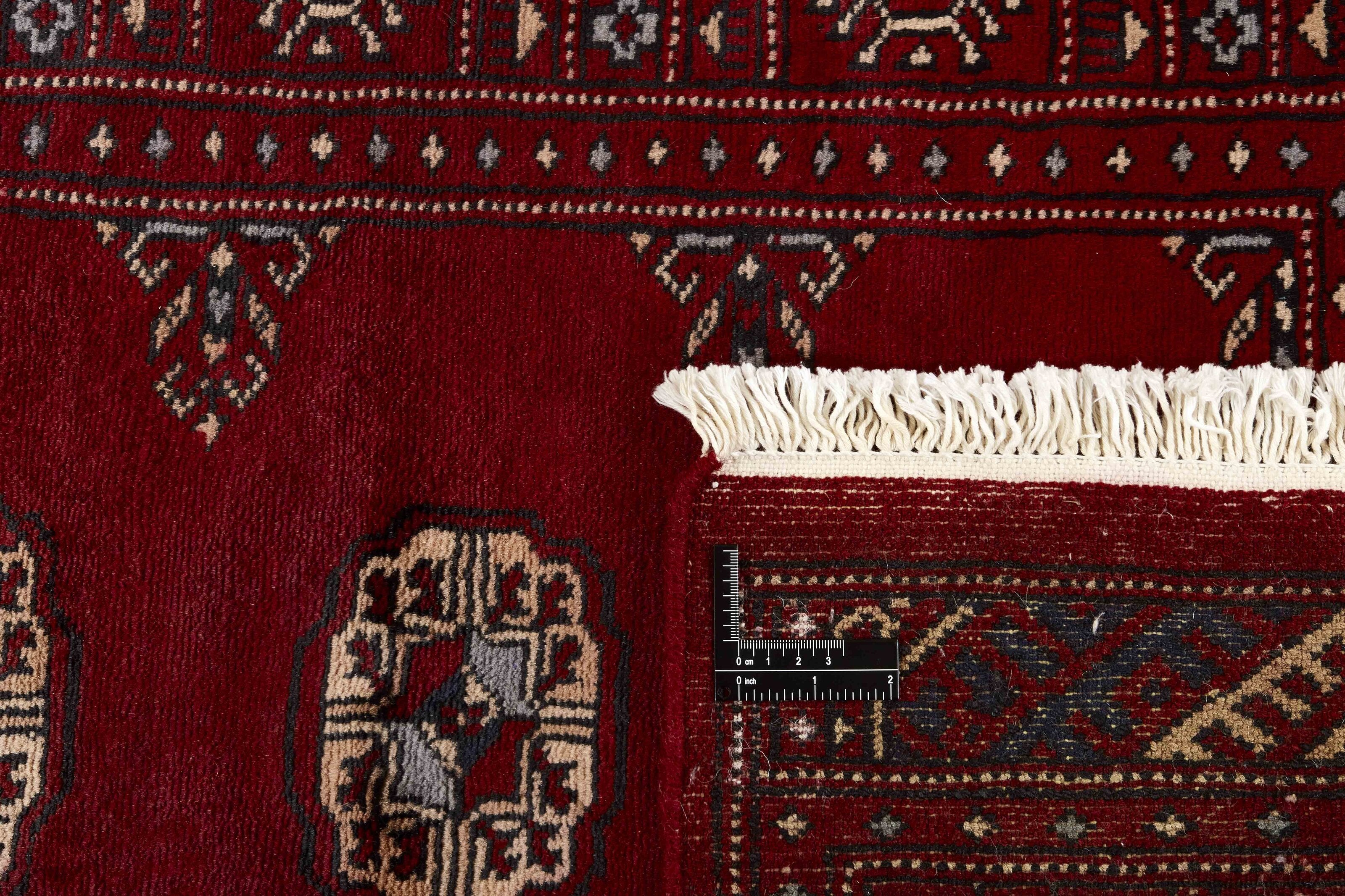 Red Oriental runner with traditional bordered pattern