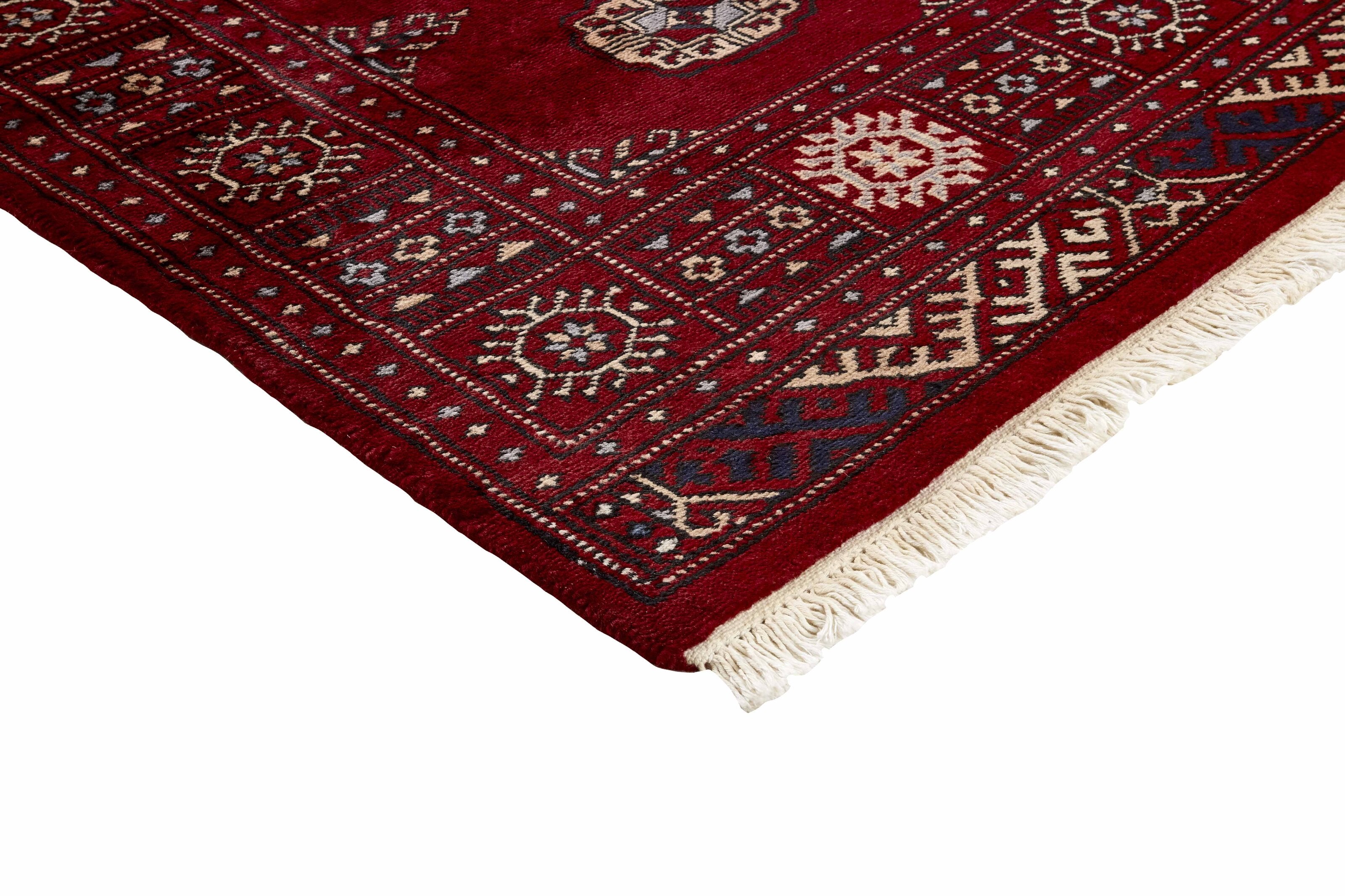 Red Oriental runner with traditional bordered pattern
