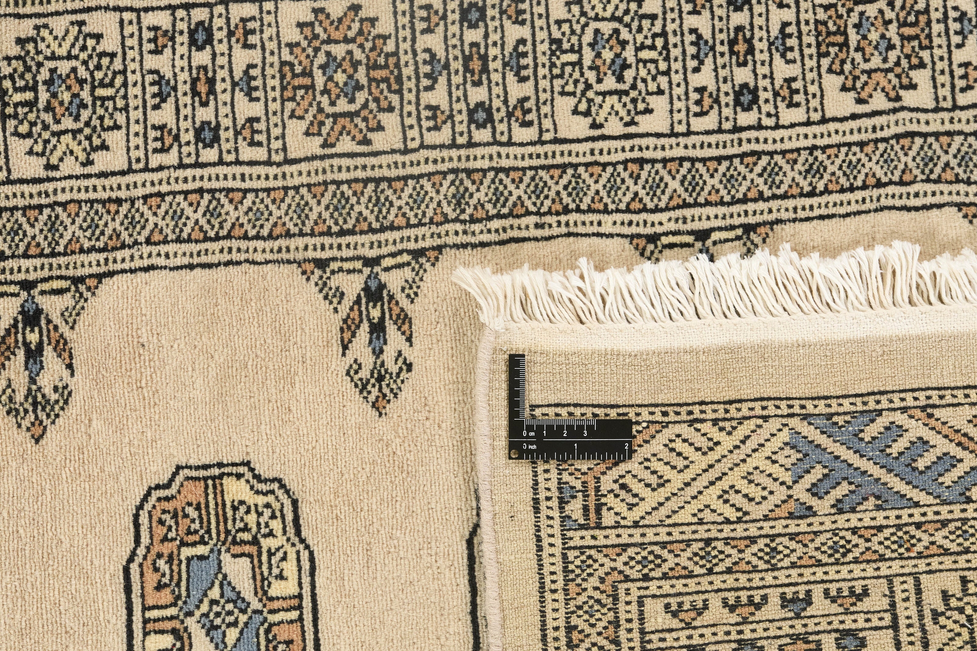 Beige Oriental runner with traditional bordered pattern