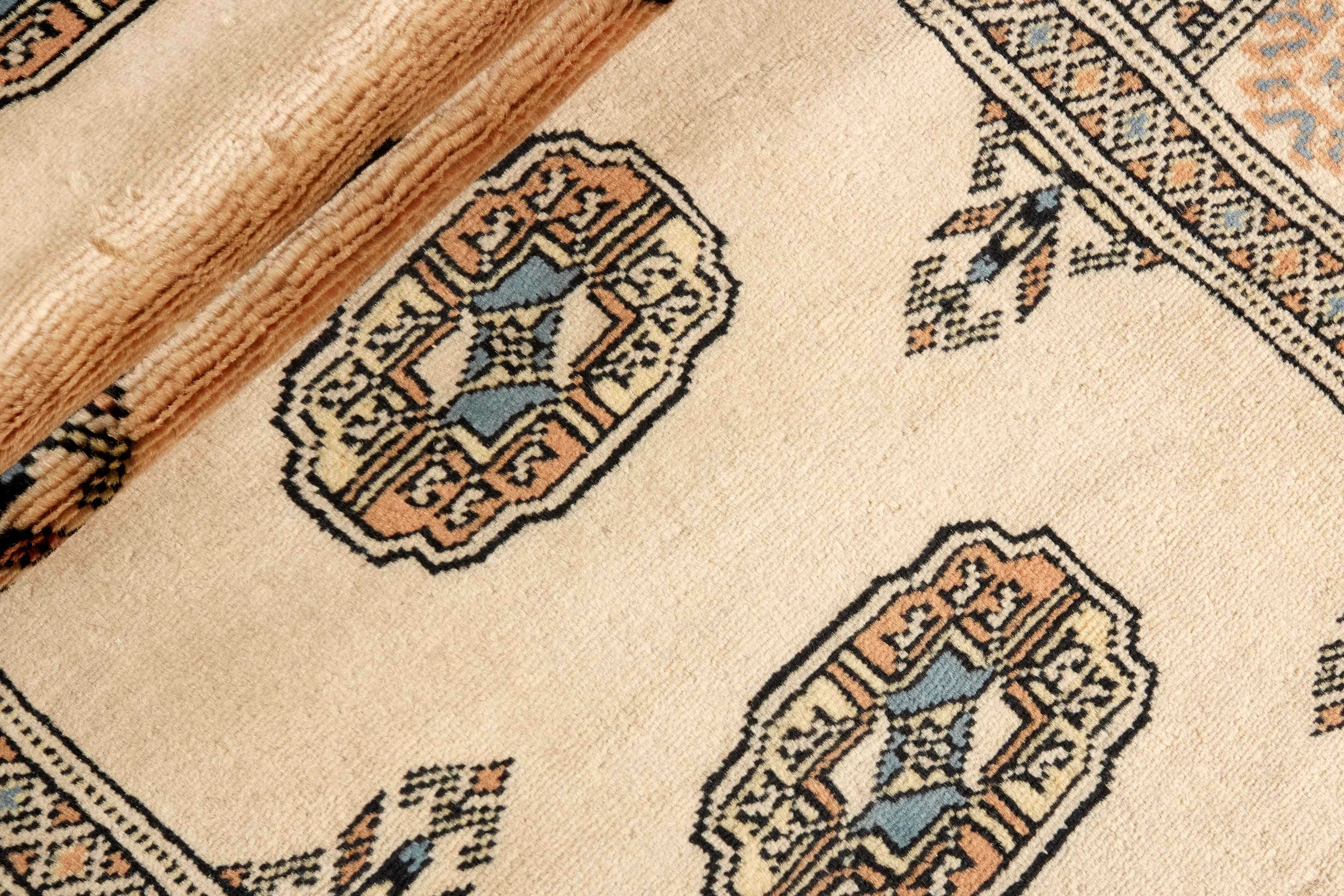 beige oriental runner with traditional gul pattern
