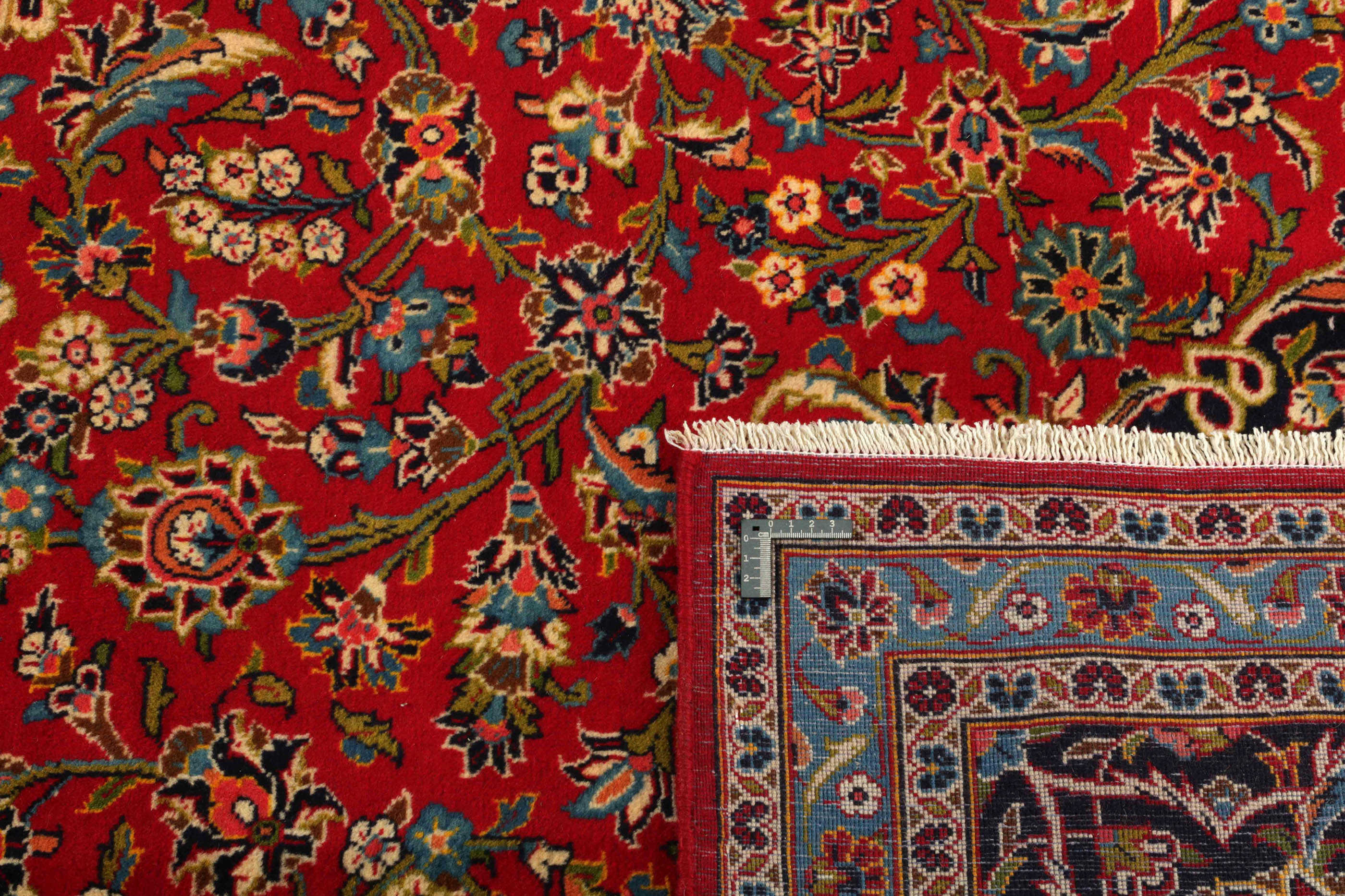 Authentic persian rug with traditional floral design in red and blue