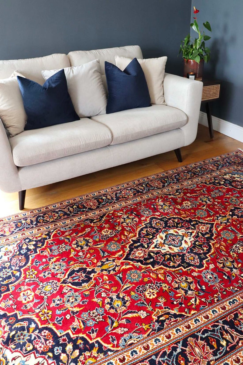Authentic persian rug with traditional floral design in red and blue