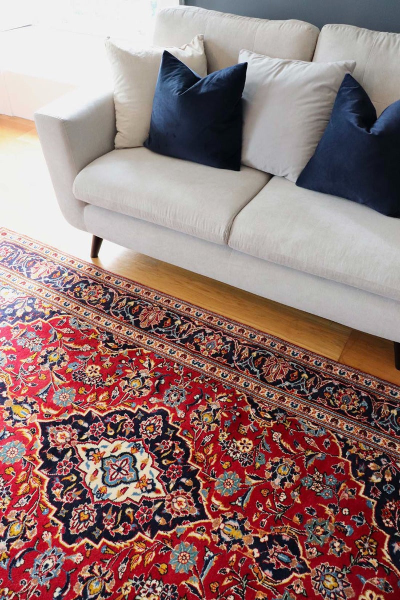 Authentic persian rug with traditional floral design in red and blue