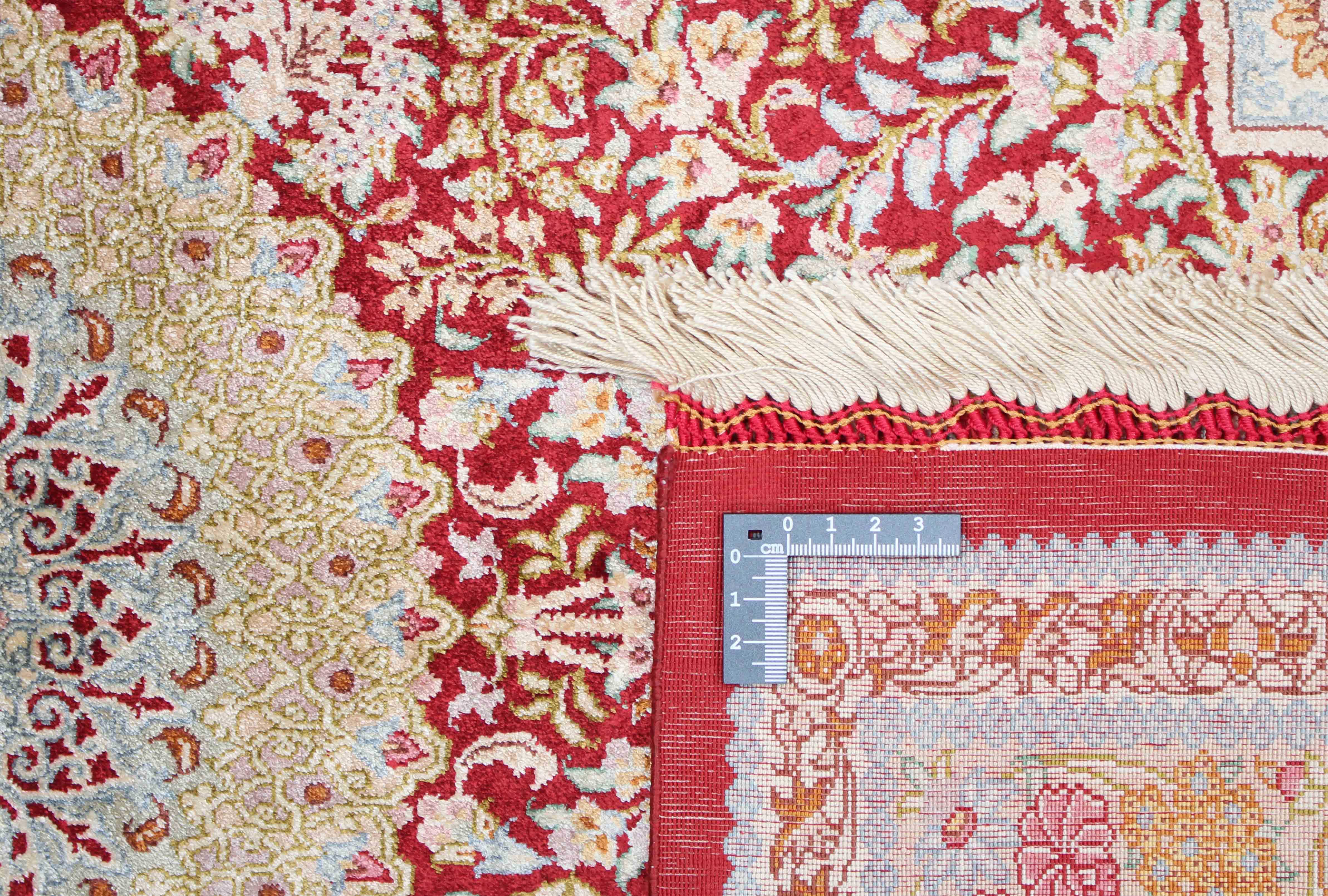 Authentic persian rug with a traditional design in red and beige