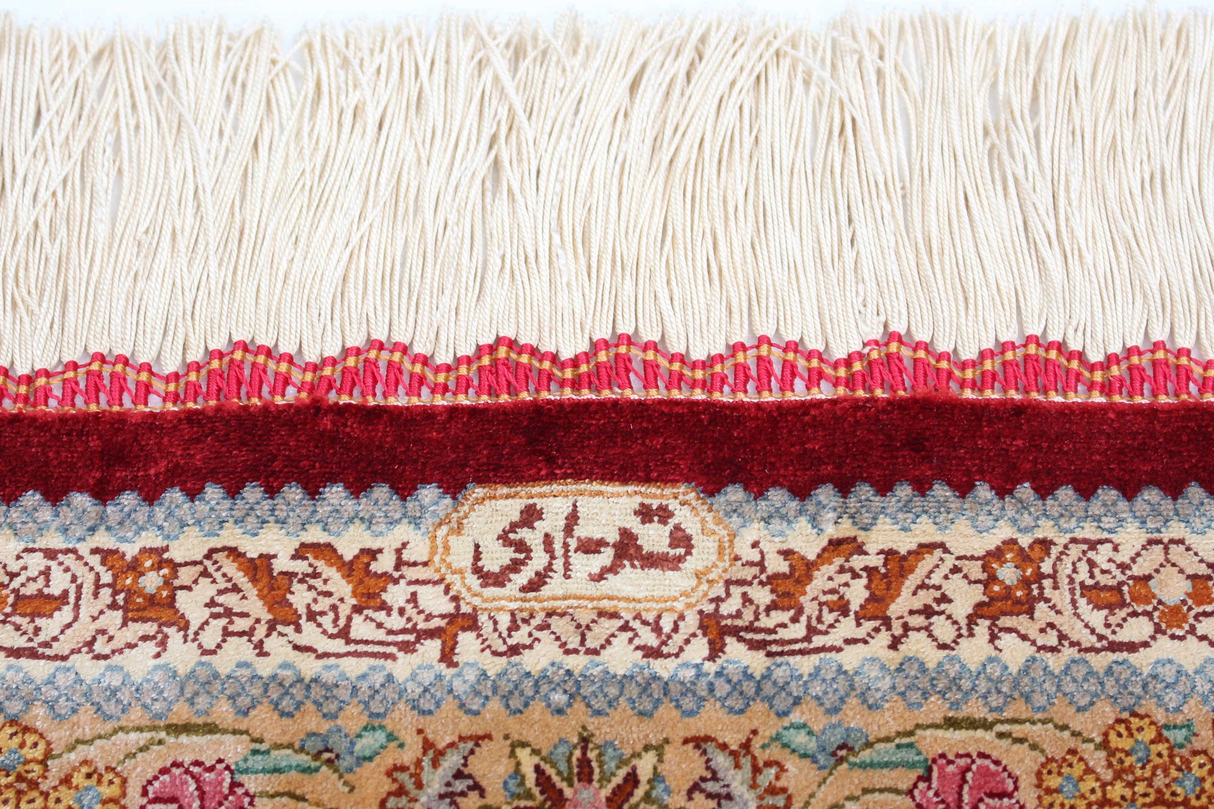 Authentic persian rug with a traditional design in red and beige