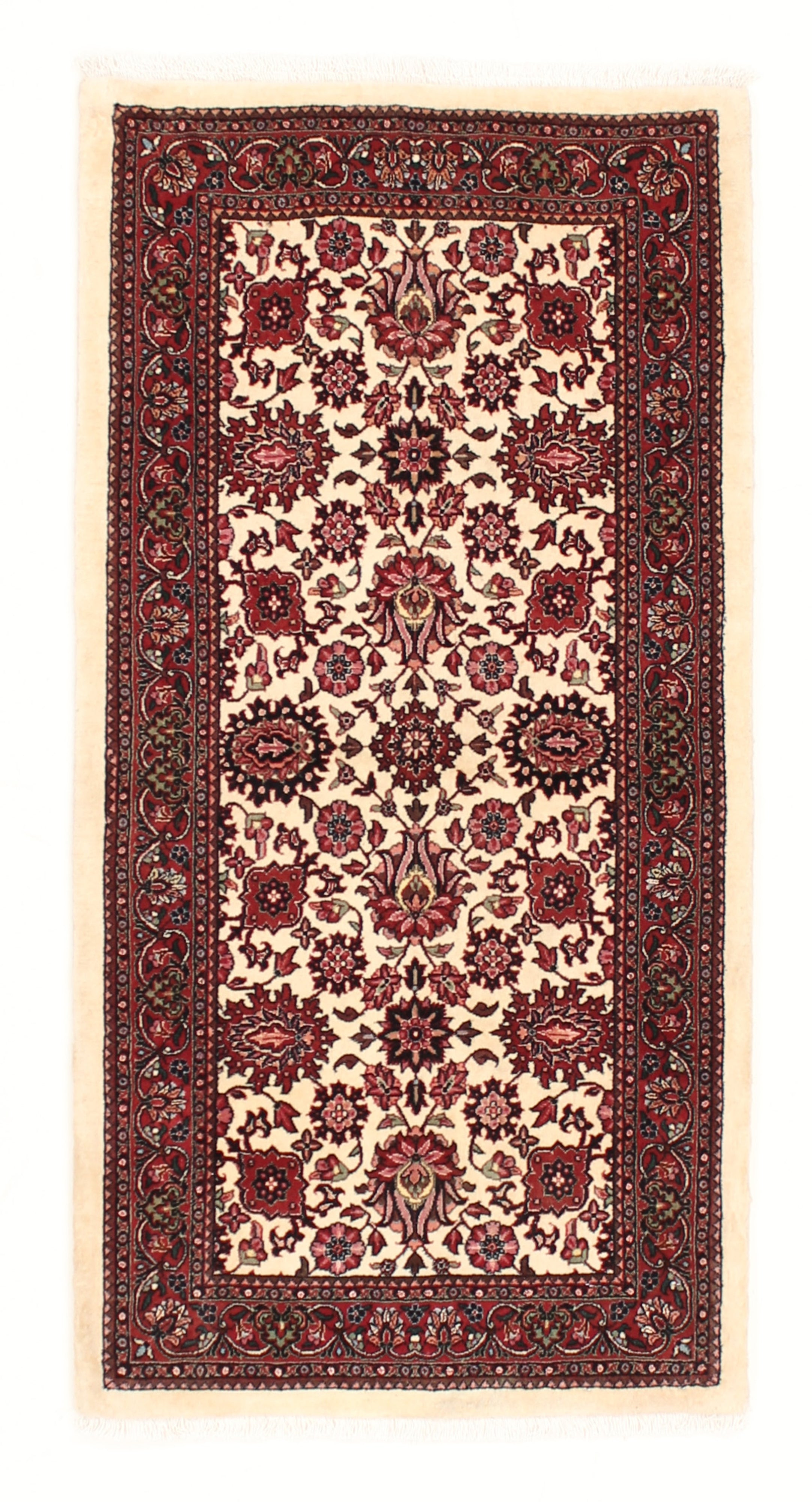 Red and cream persian rug with traditional floral design