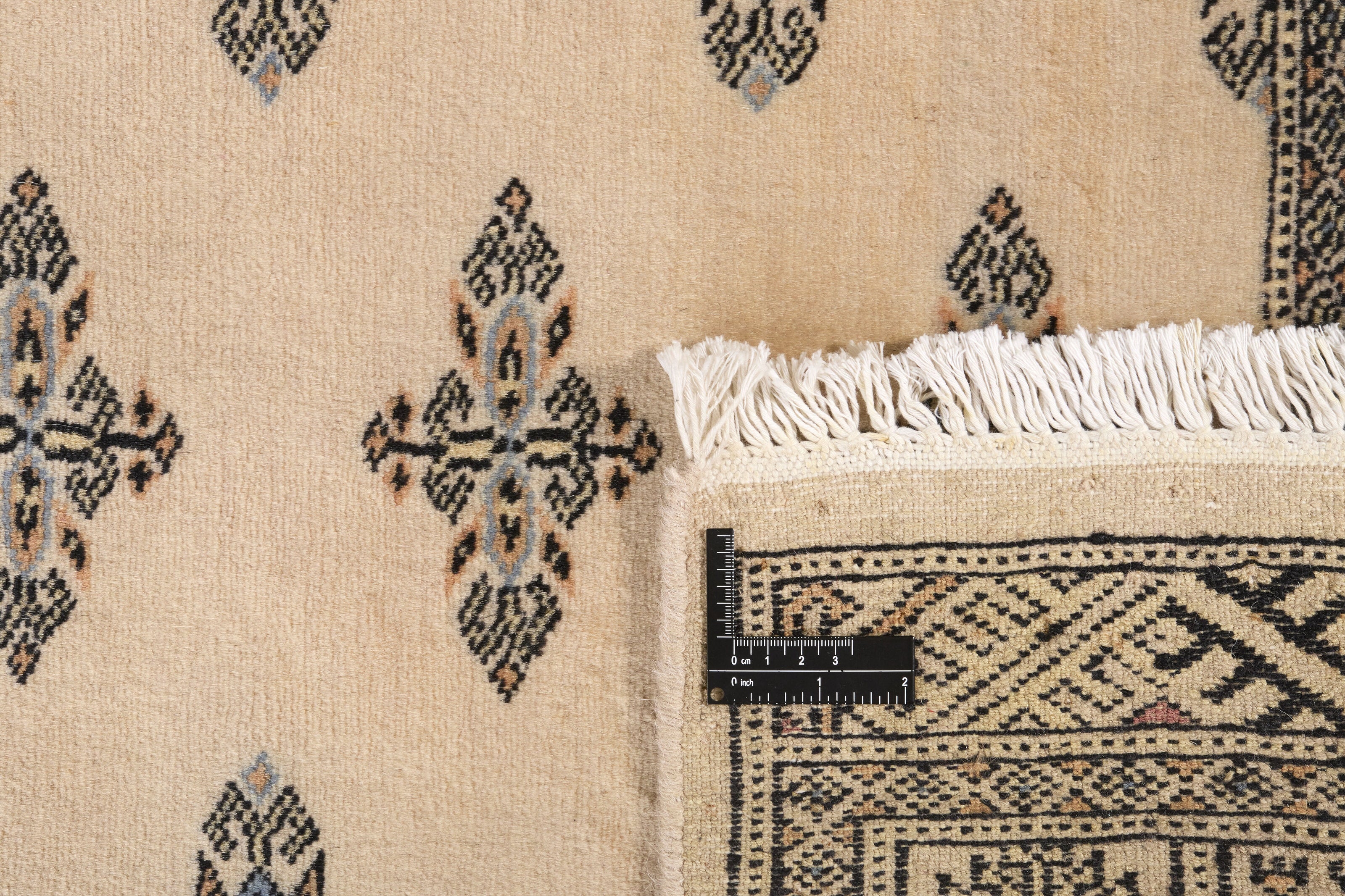 Beige Oriental runner with traditional bordered pattern