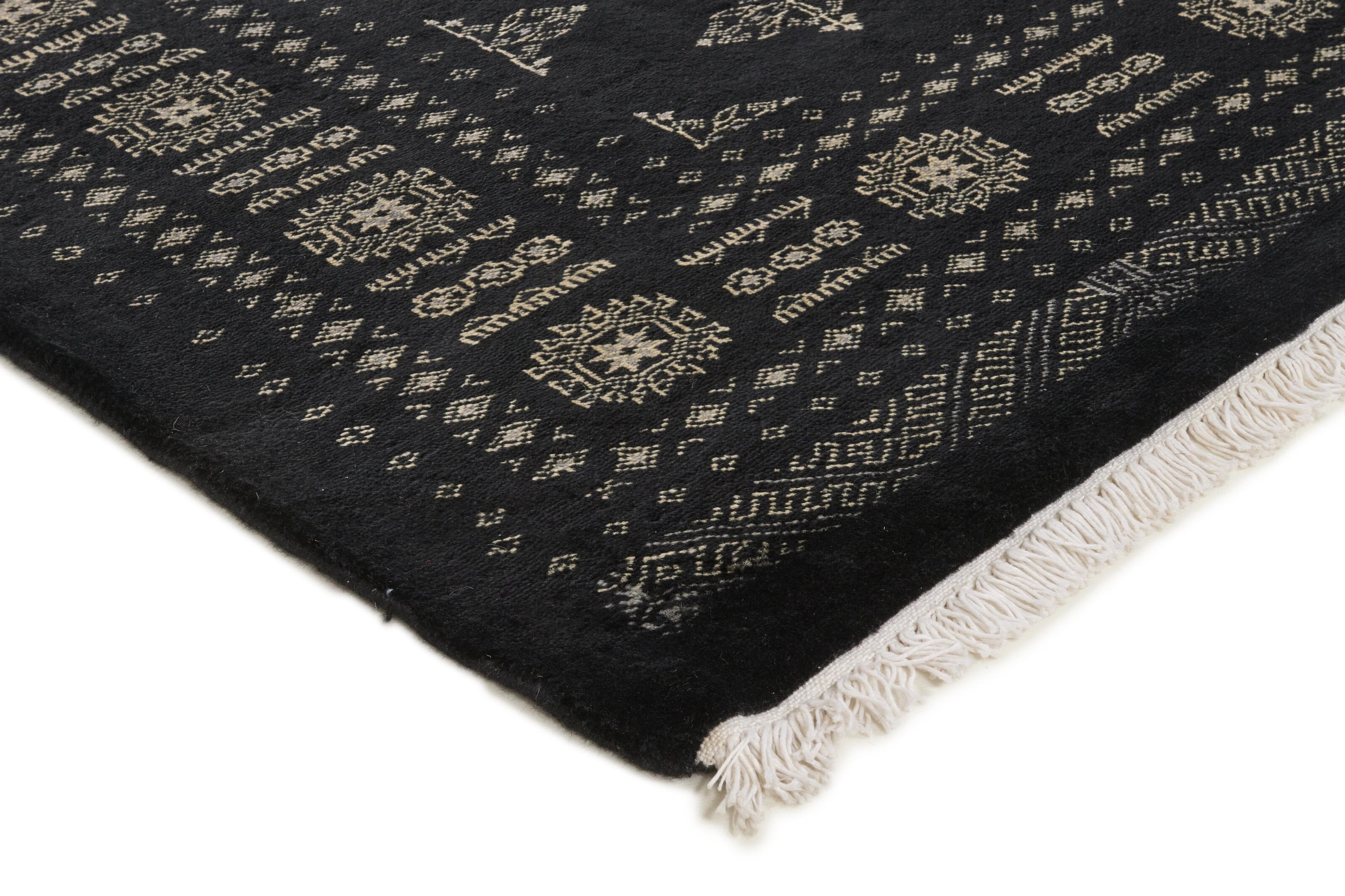 Black Oriental rug with traditional bordered pattern