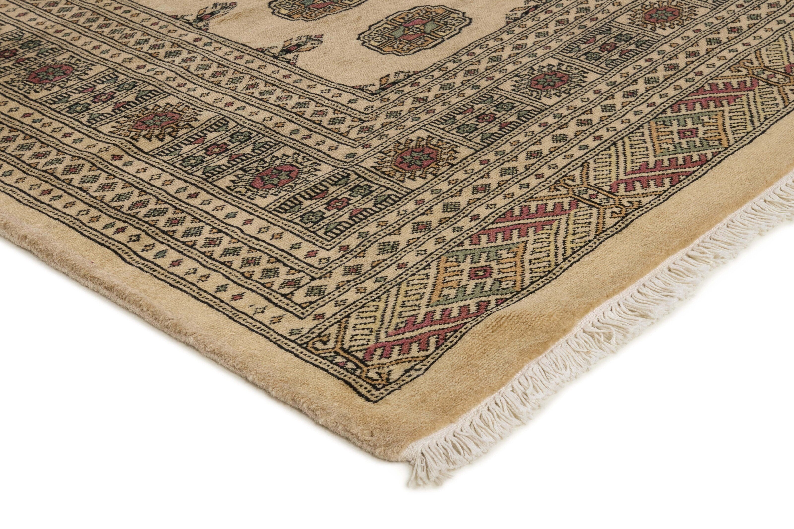 Beige Oriental rug with traditional bordered pattern
