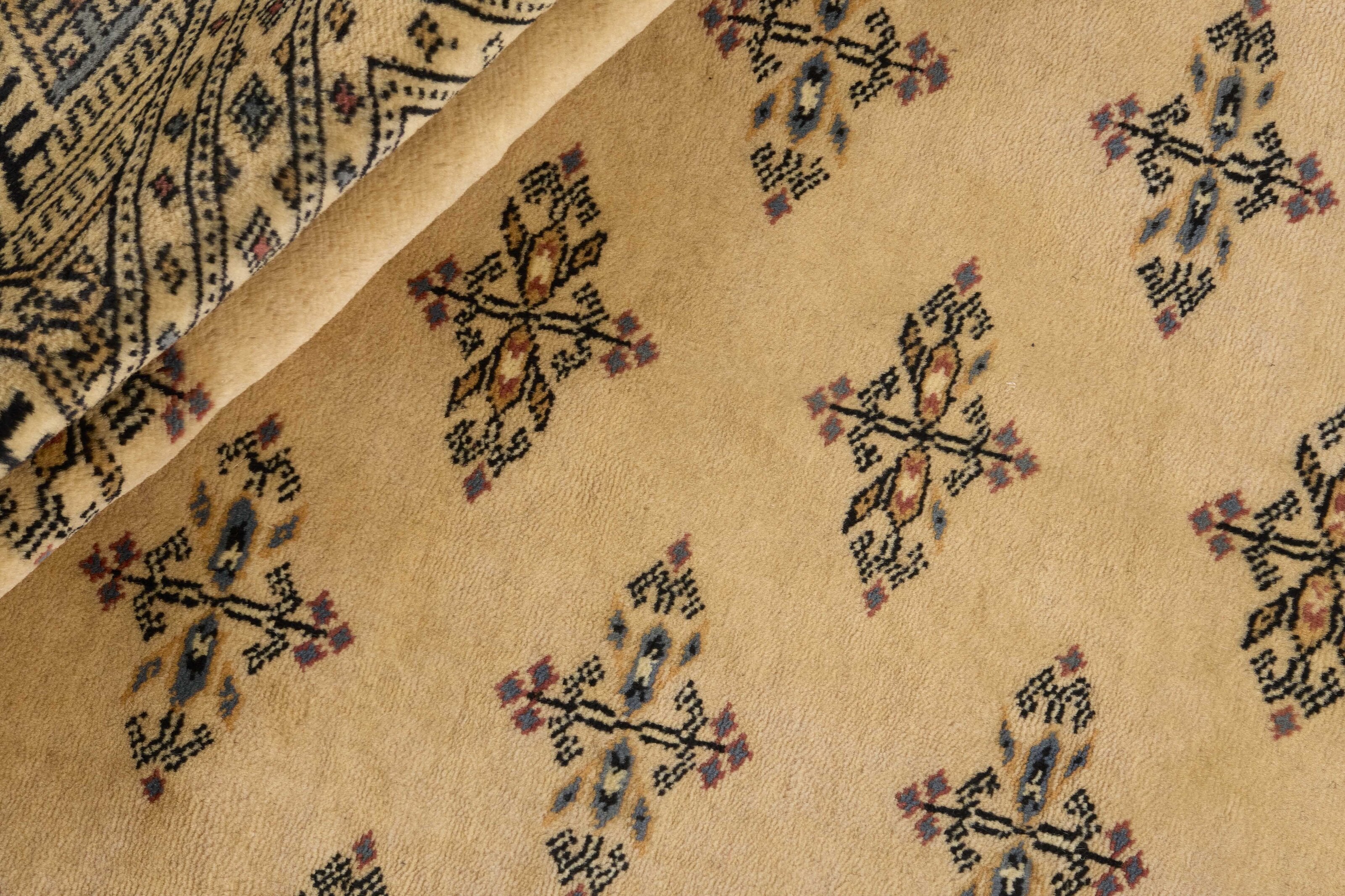 Beige Oriental rug with traditional bordered pattern