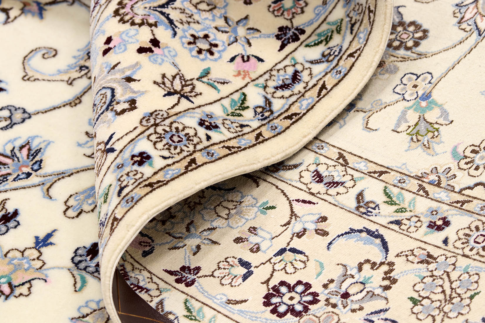 Authentic oriental rug with traditional floral design in cream