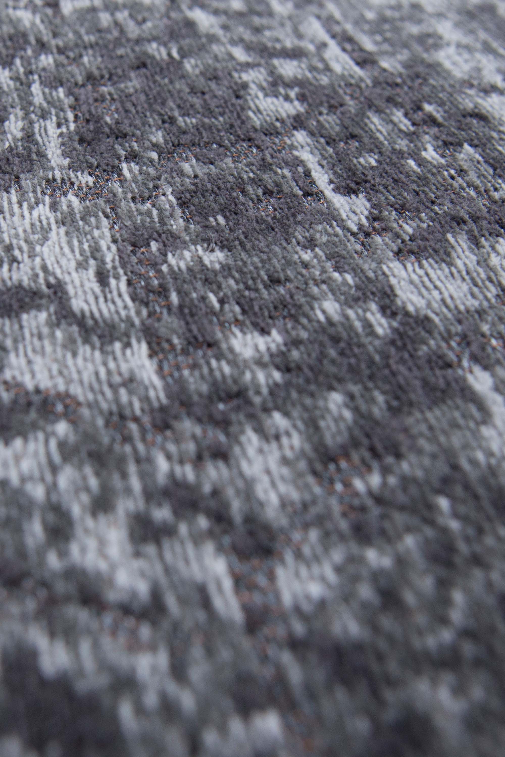 Black flatweave runner rug with faded grey chevron pattern