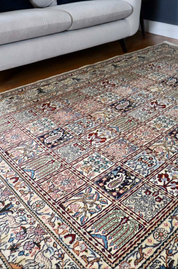 authentic persian rug with floral pattern in beige