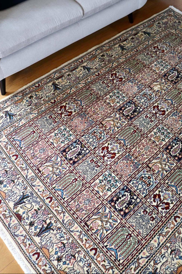 authentic persian rug with floral pattern in beige