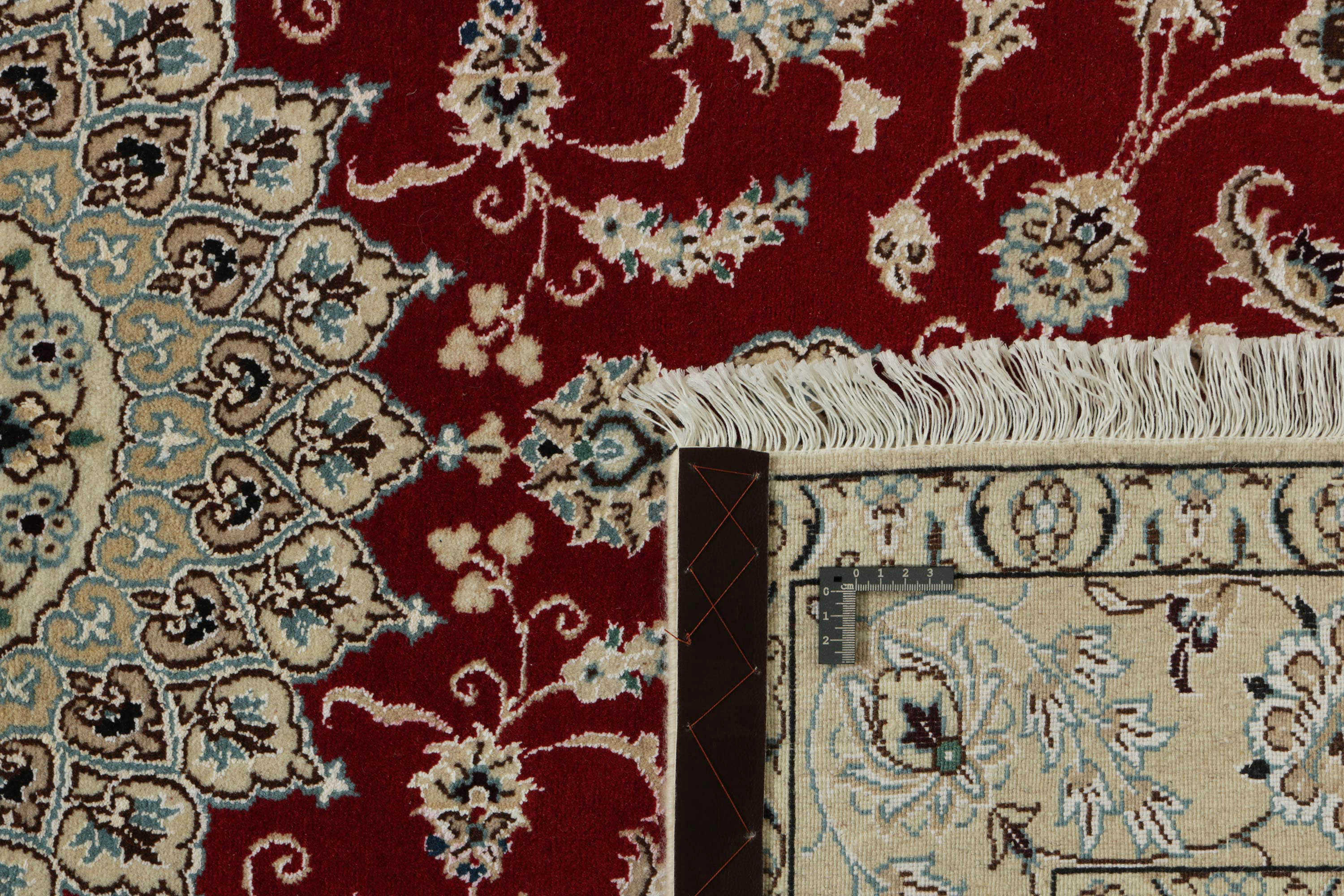 Authentic oriental rug with traditional floral design in red