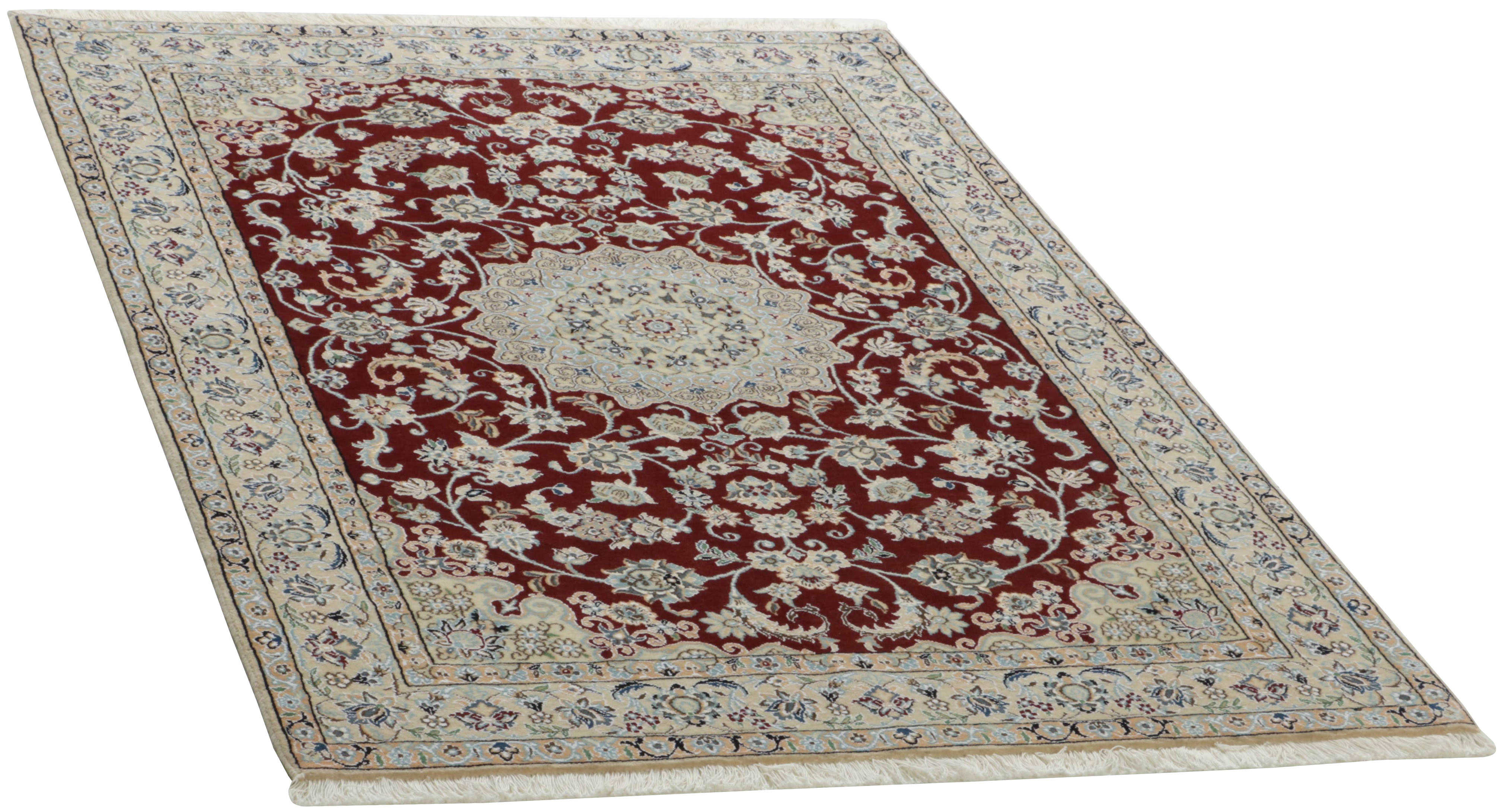 Authentic oriental rug with traditional floral design in red