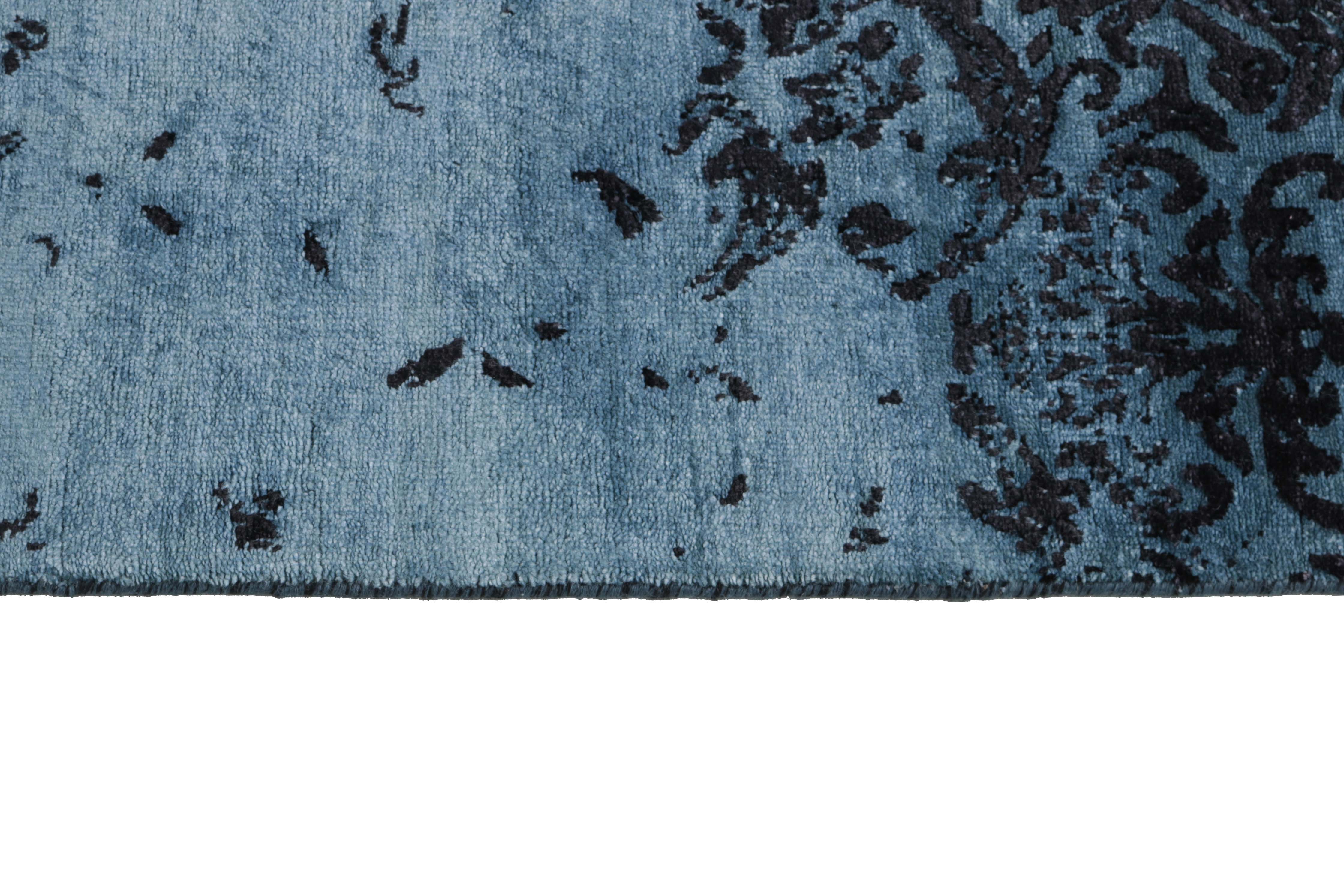 Authentic oriental rug with a damask pattern in blue