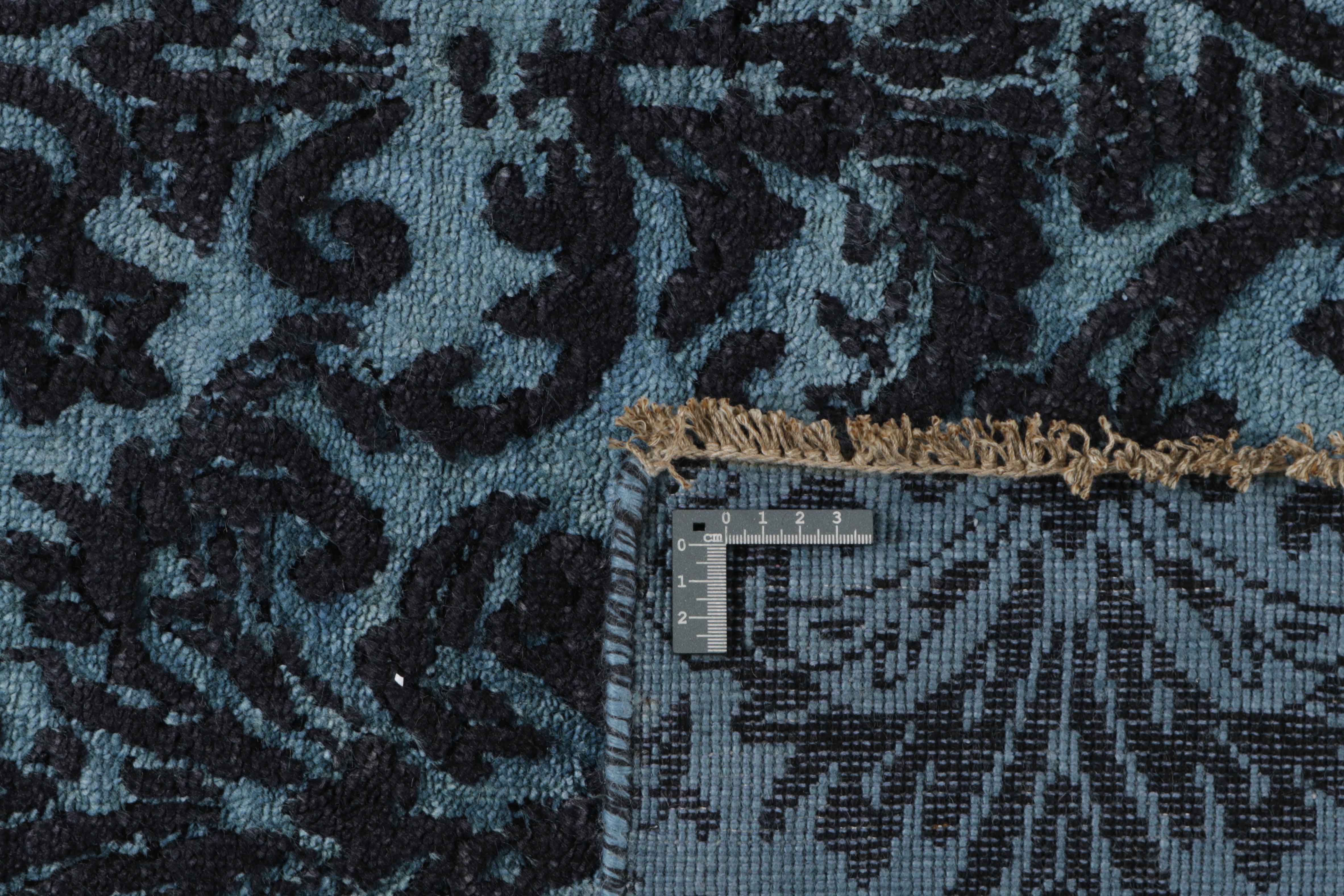 Authentic oriental rug with a damask pattern in blue