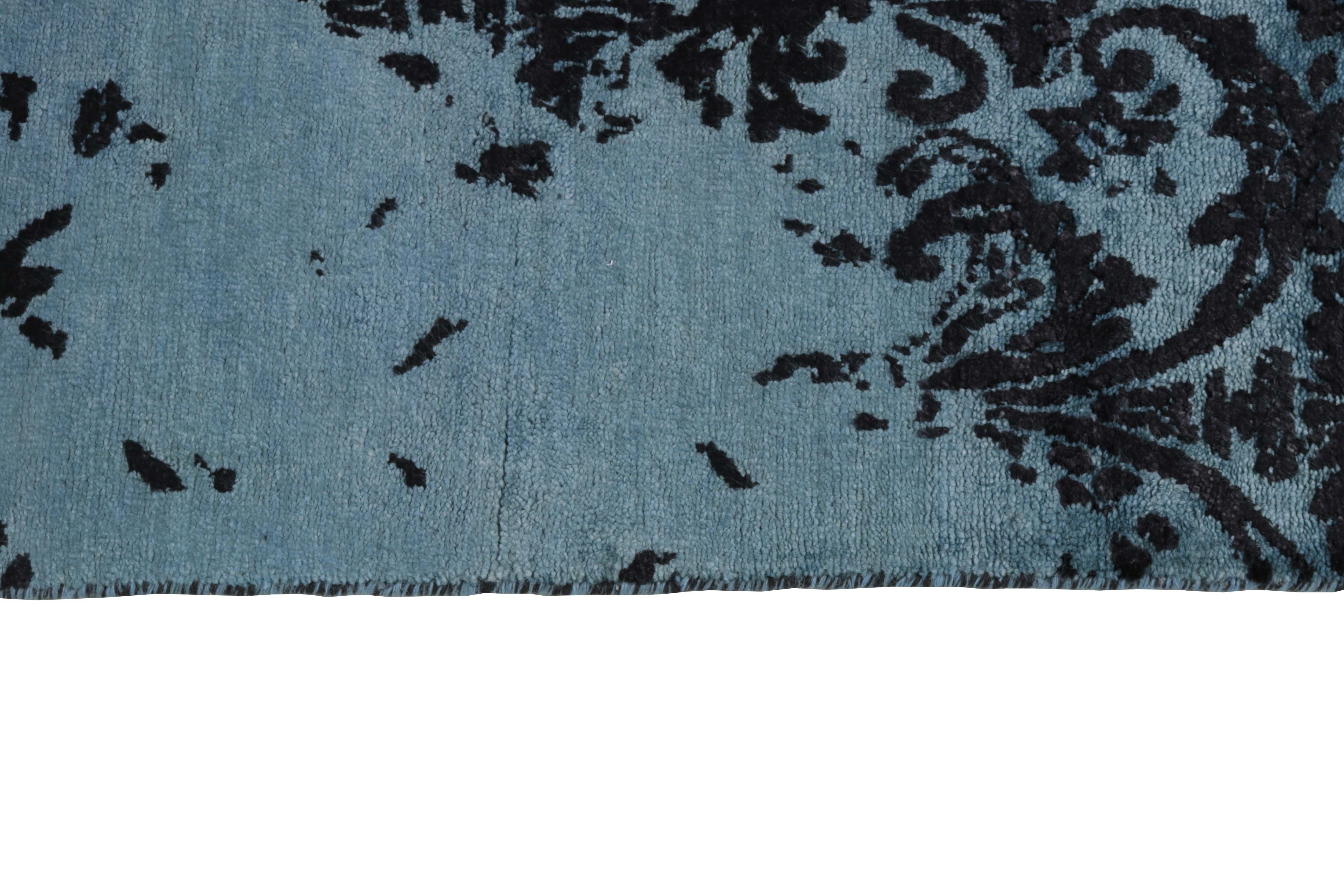 Authentic oriental rug with a damask pattern in blue