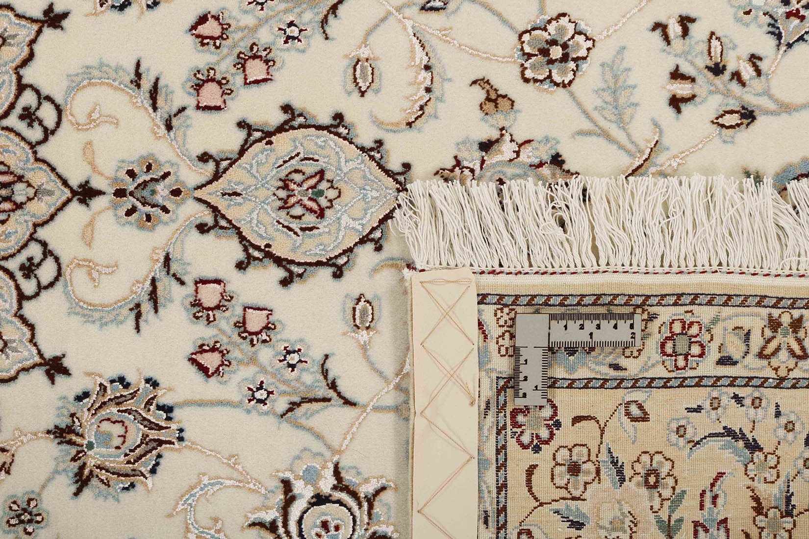 Authentic oriental rug with traditional floral design in cream