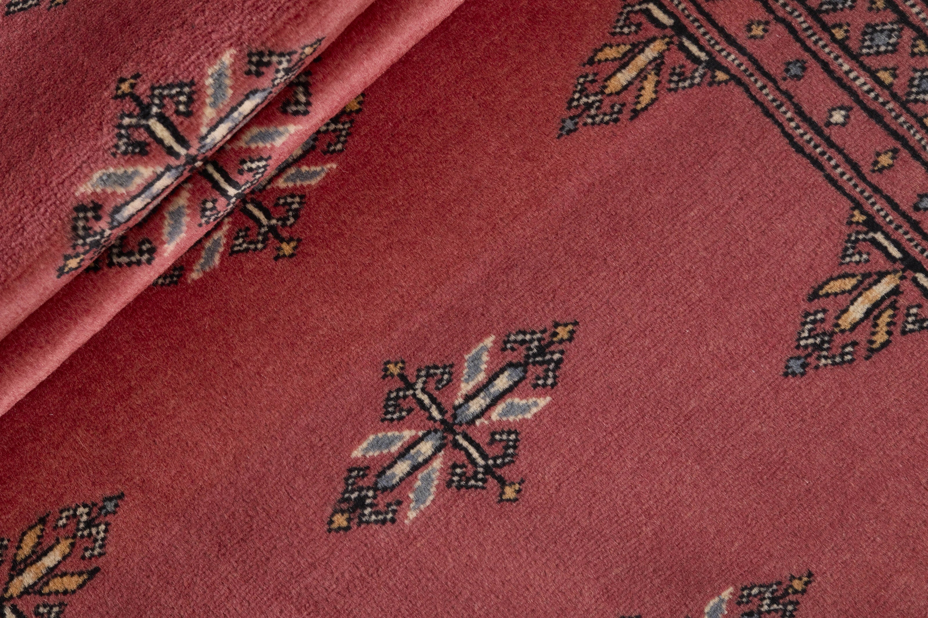Red Oriental runner with traditional bordered pattern