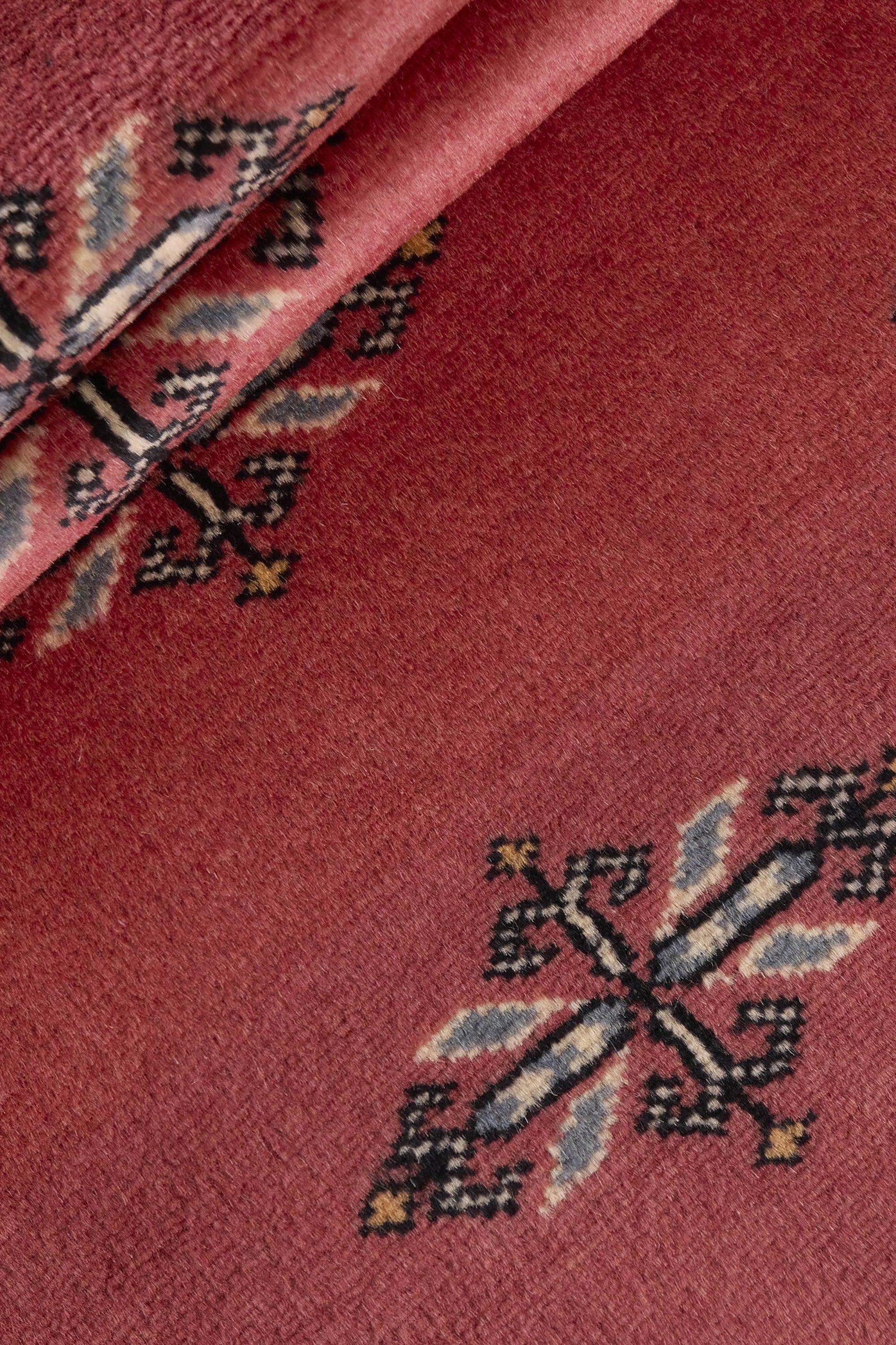 Red Oriental runner with traditional bordered pattern