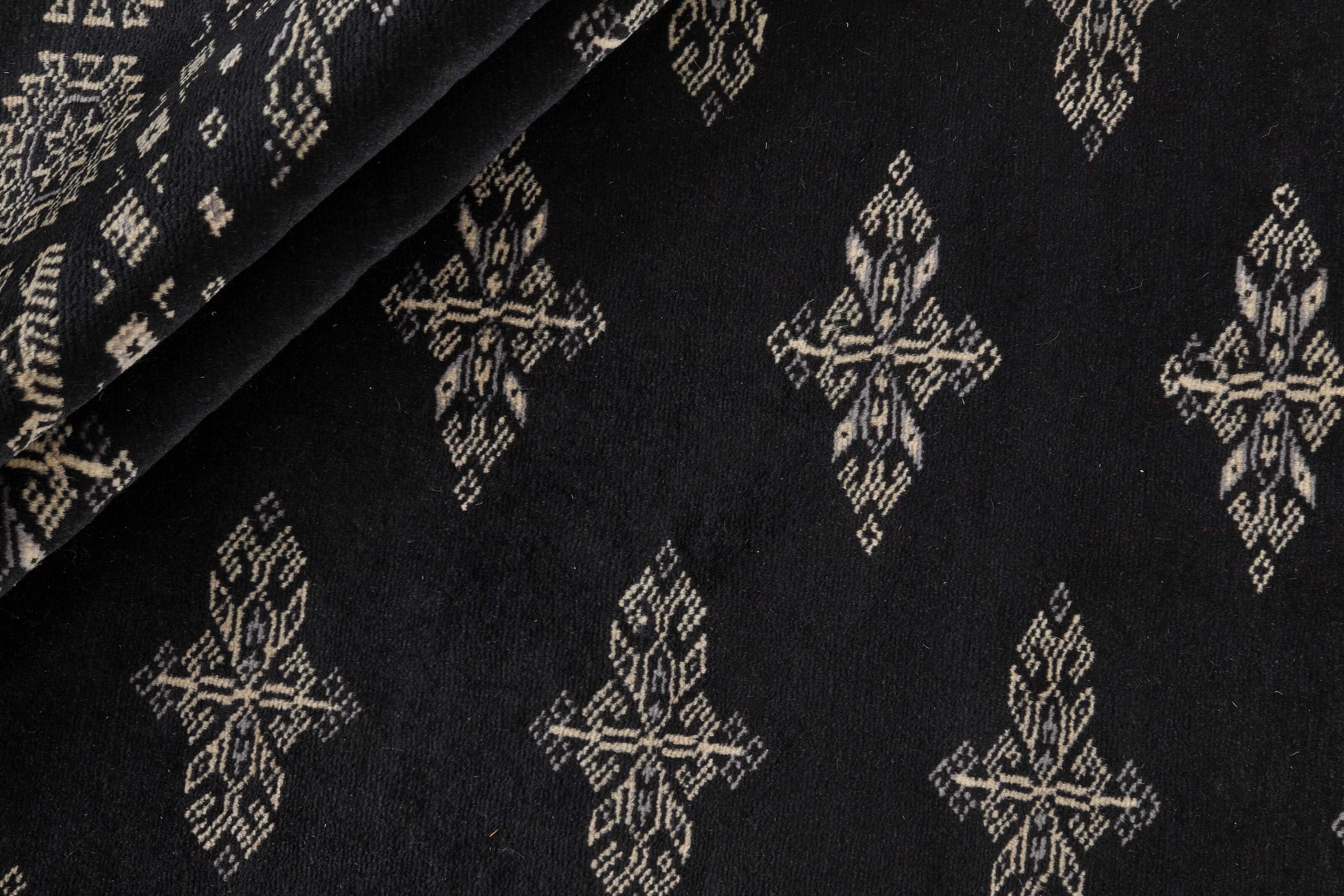 Black Oriental runner with traditional bordered pattern