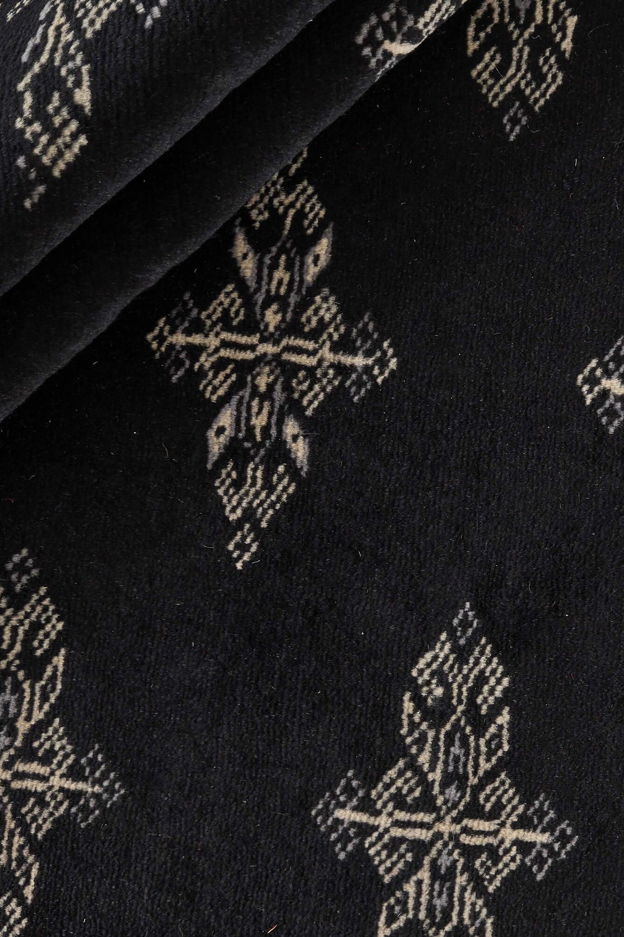 Black Oriental runner with traditional bordered pattern