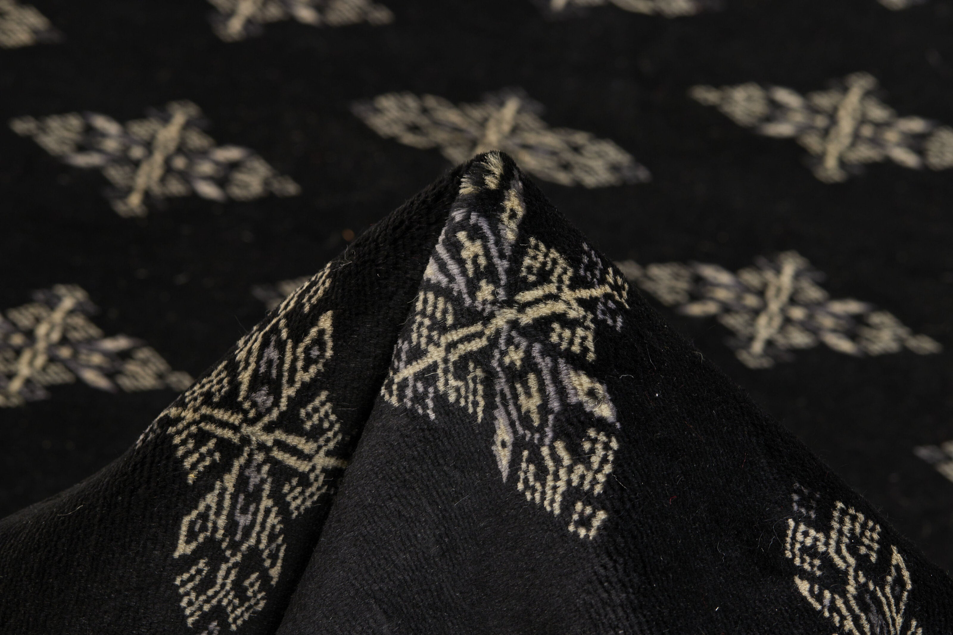 Black Oriental runner with traditional bordered pattern