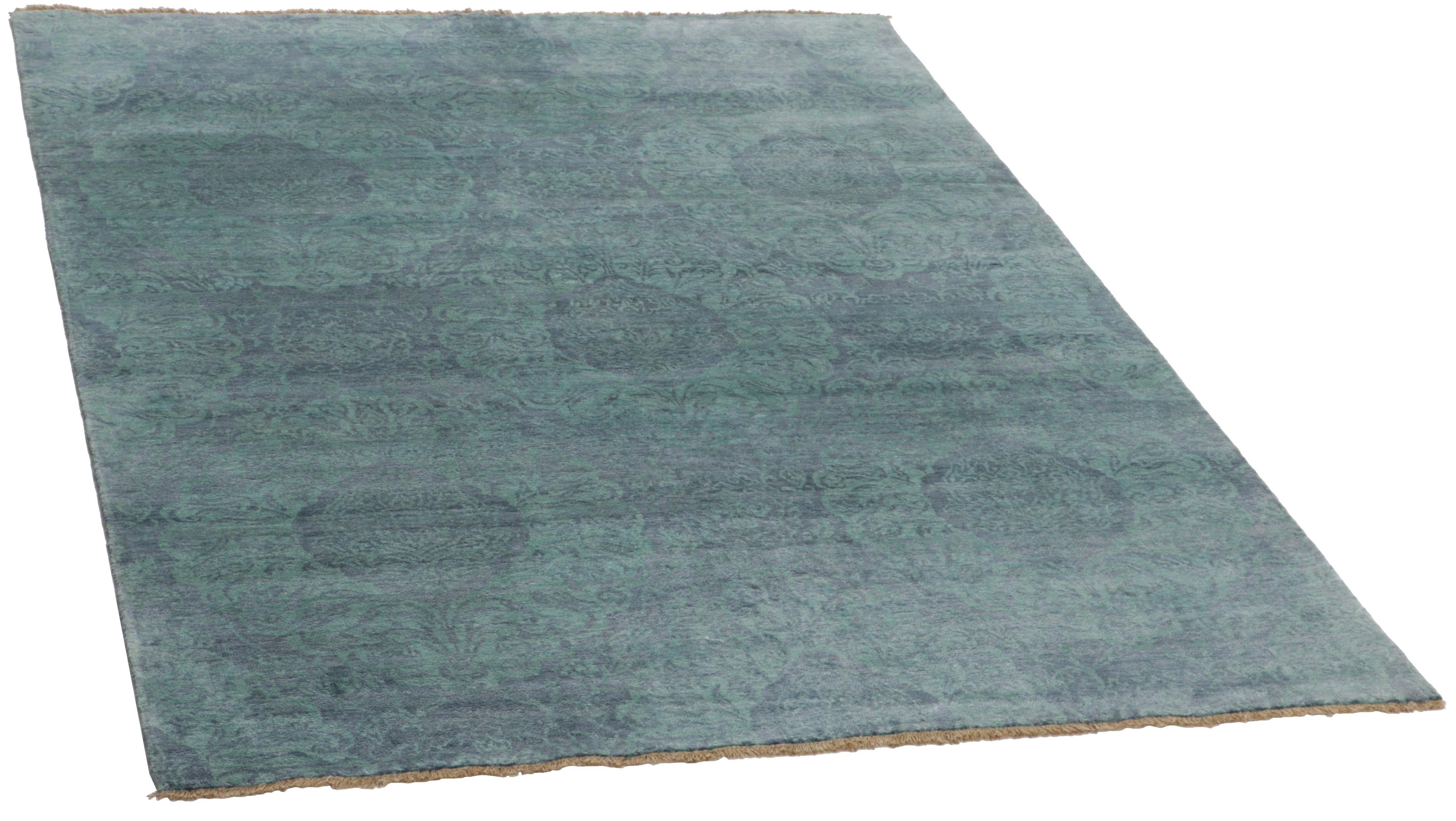 Authentic oriental rug with a damask pattern in blue