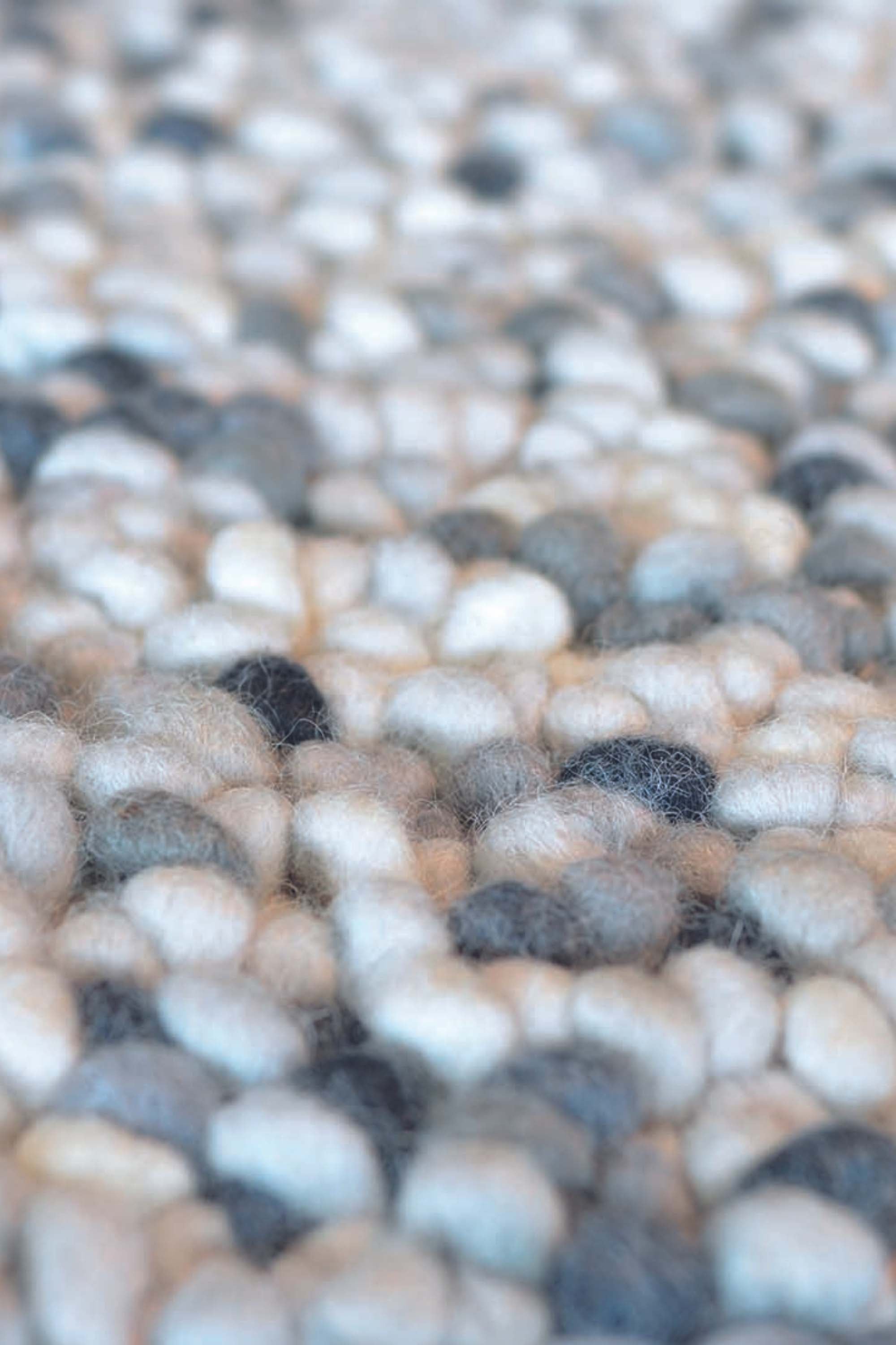 cream and grey textured area rug