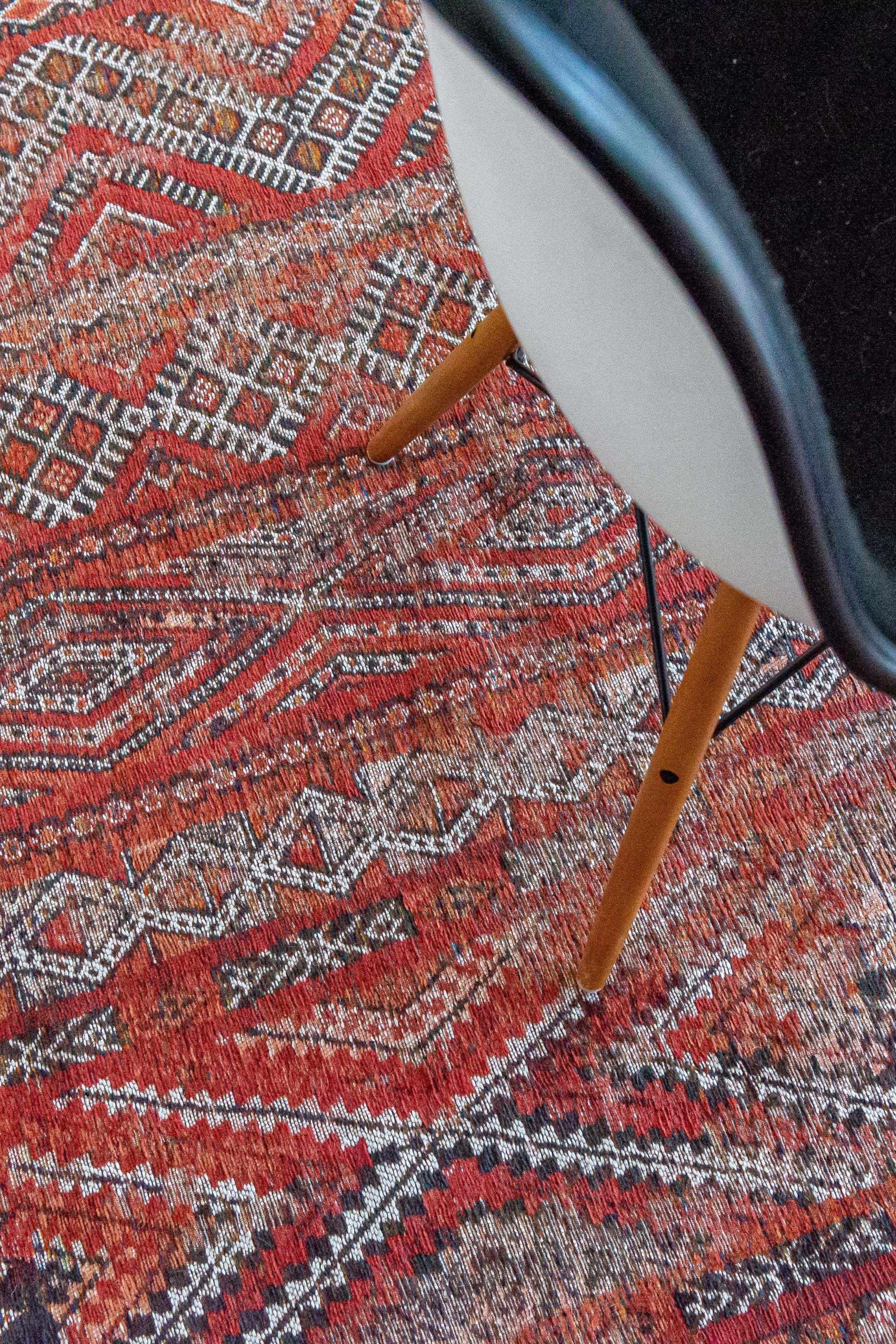 red rug with a moroccan geometric pattern