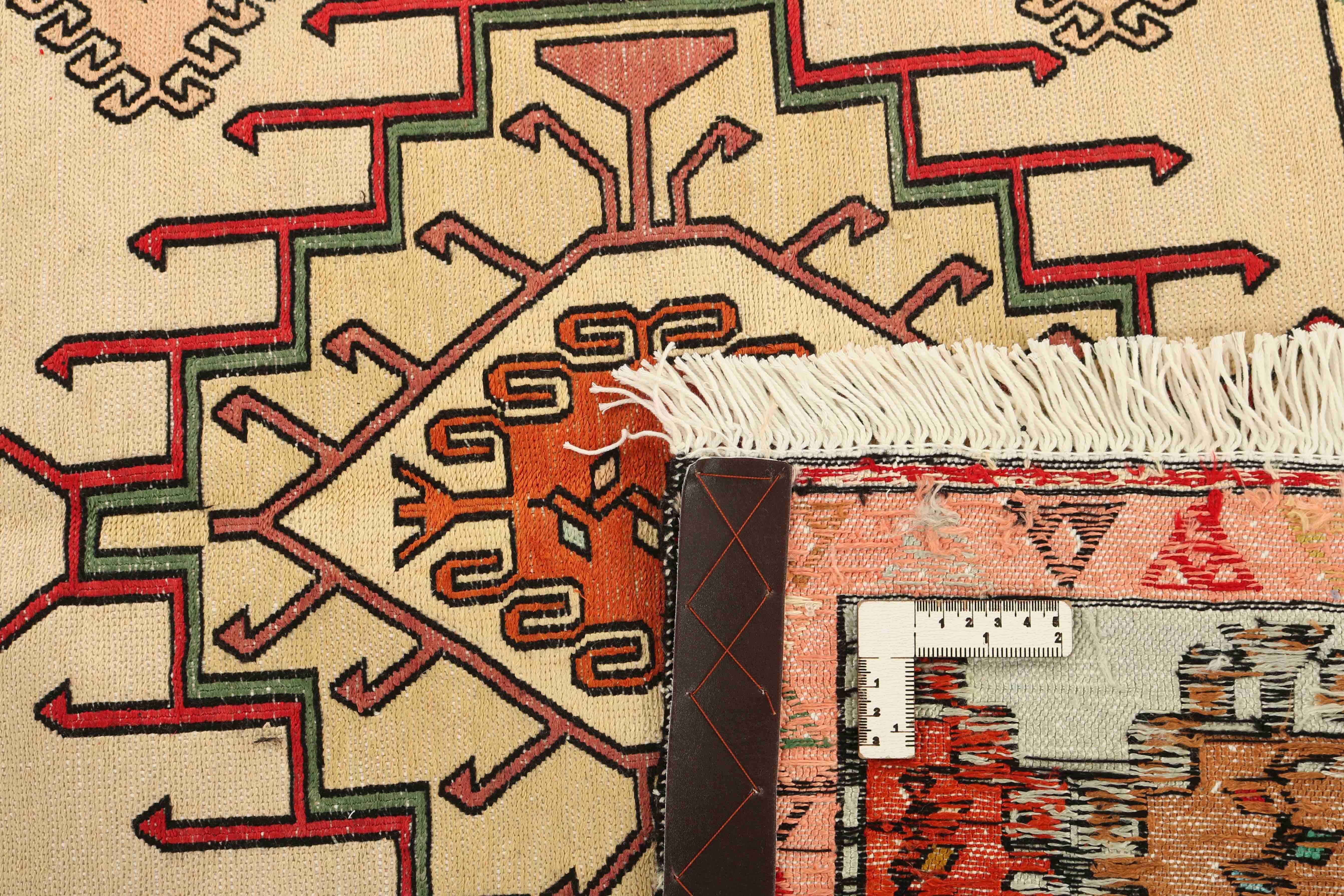 Authentic persian rug with tribal geometric design in beige and red