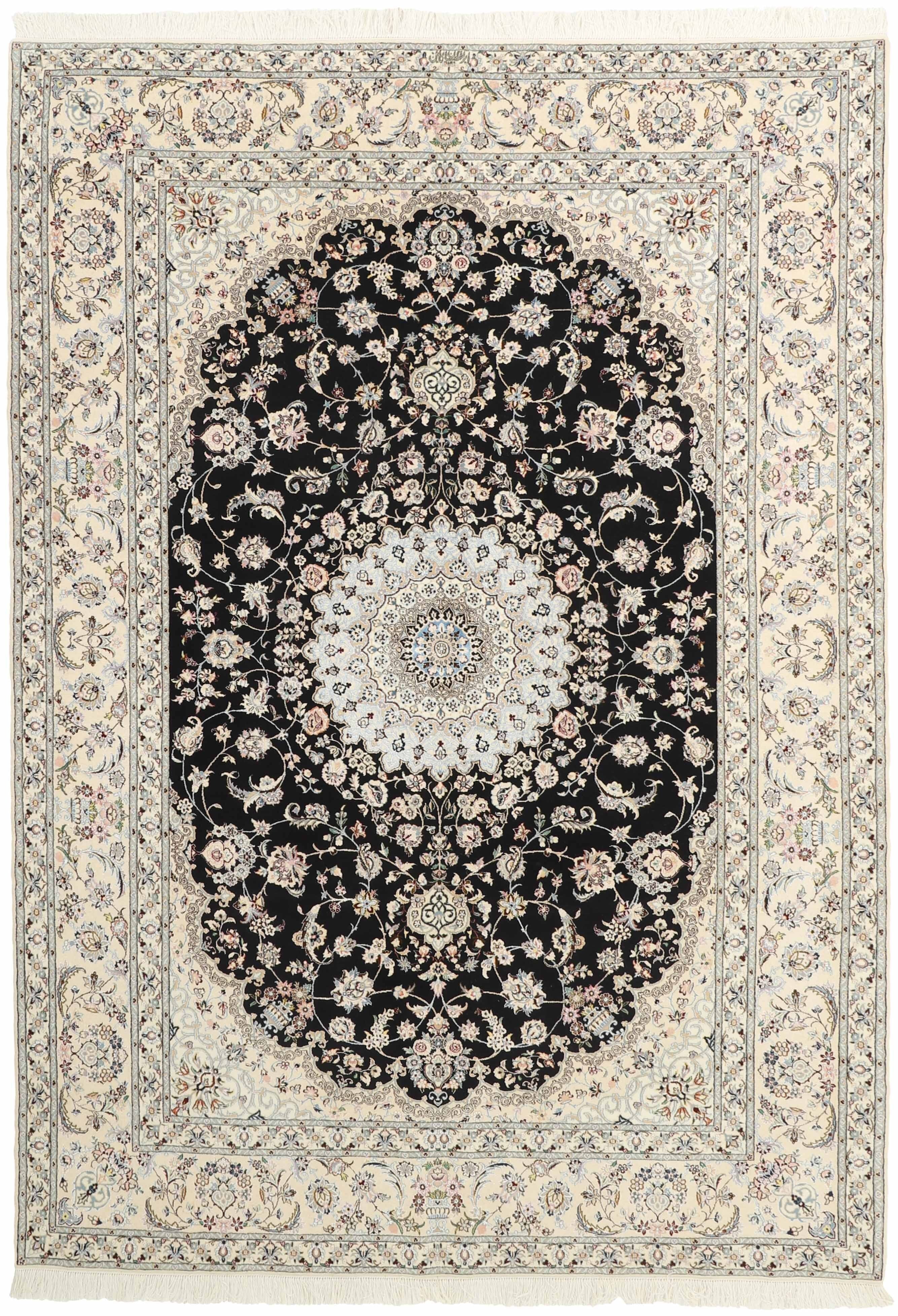 Authentic oriental rug with traditional floral design in cream, navy, blue and pink