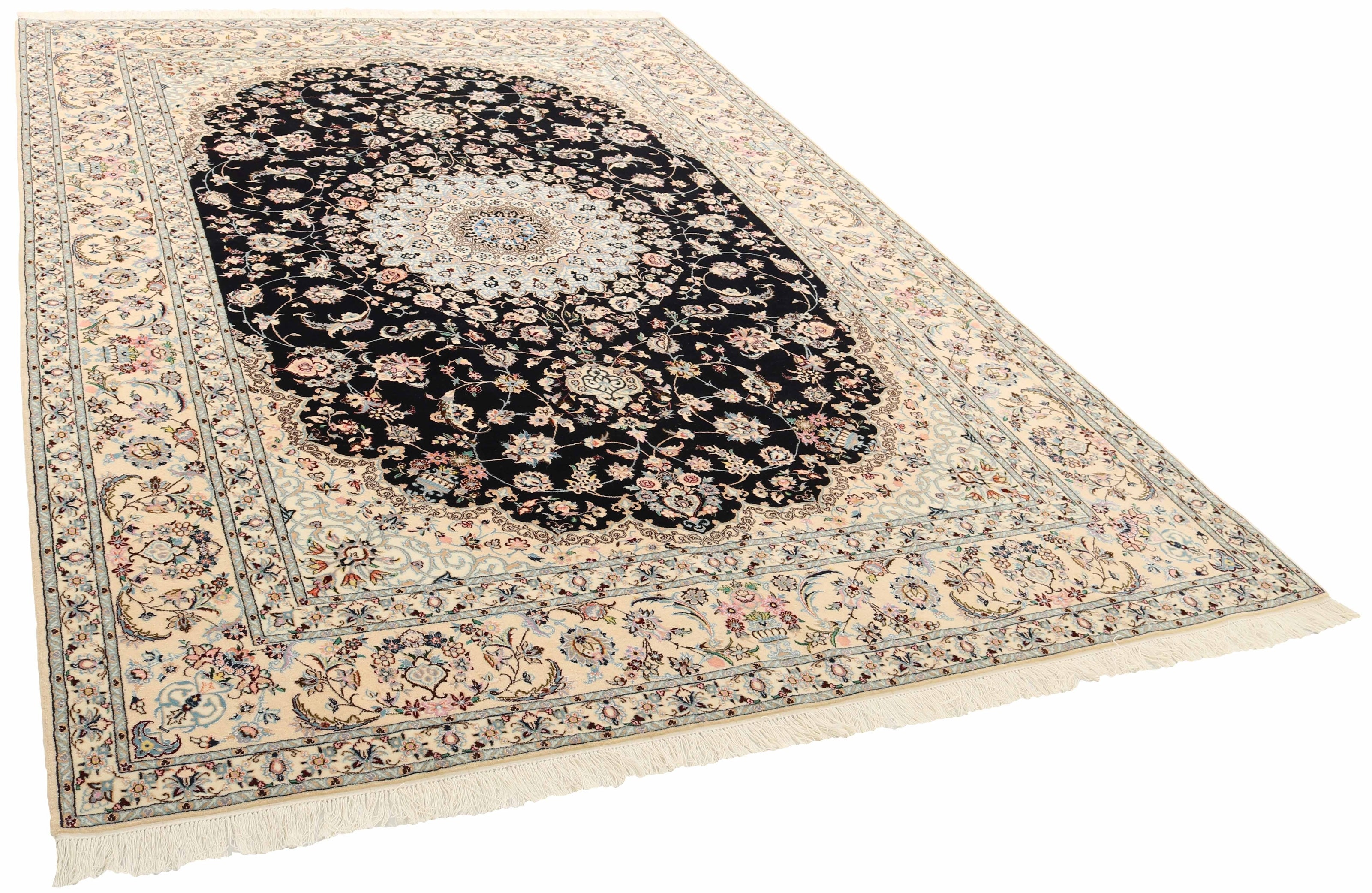 Authentic oriental rug with traditional floral design in cream, navy, blue and pink