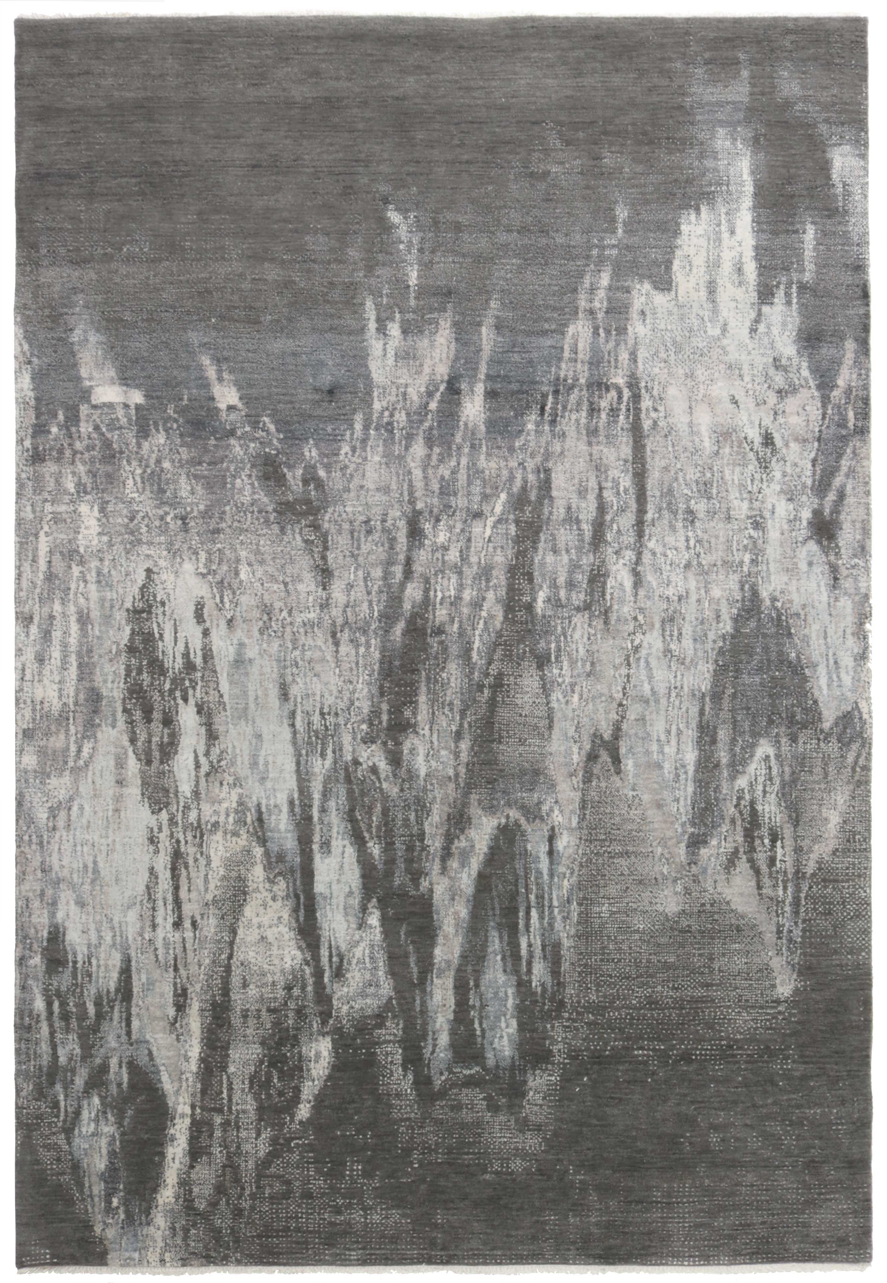 Area rug with abstract design in grey and beige
