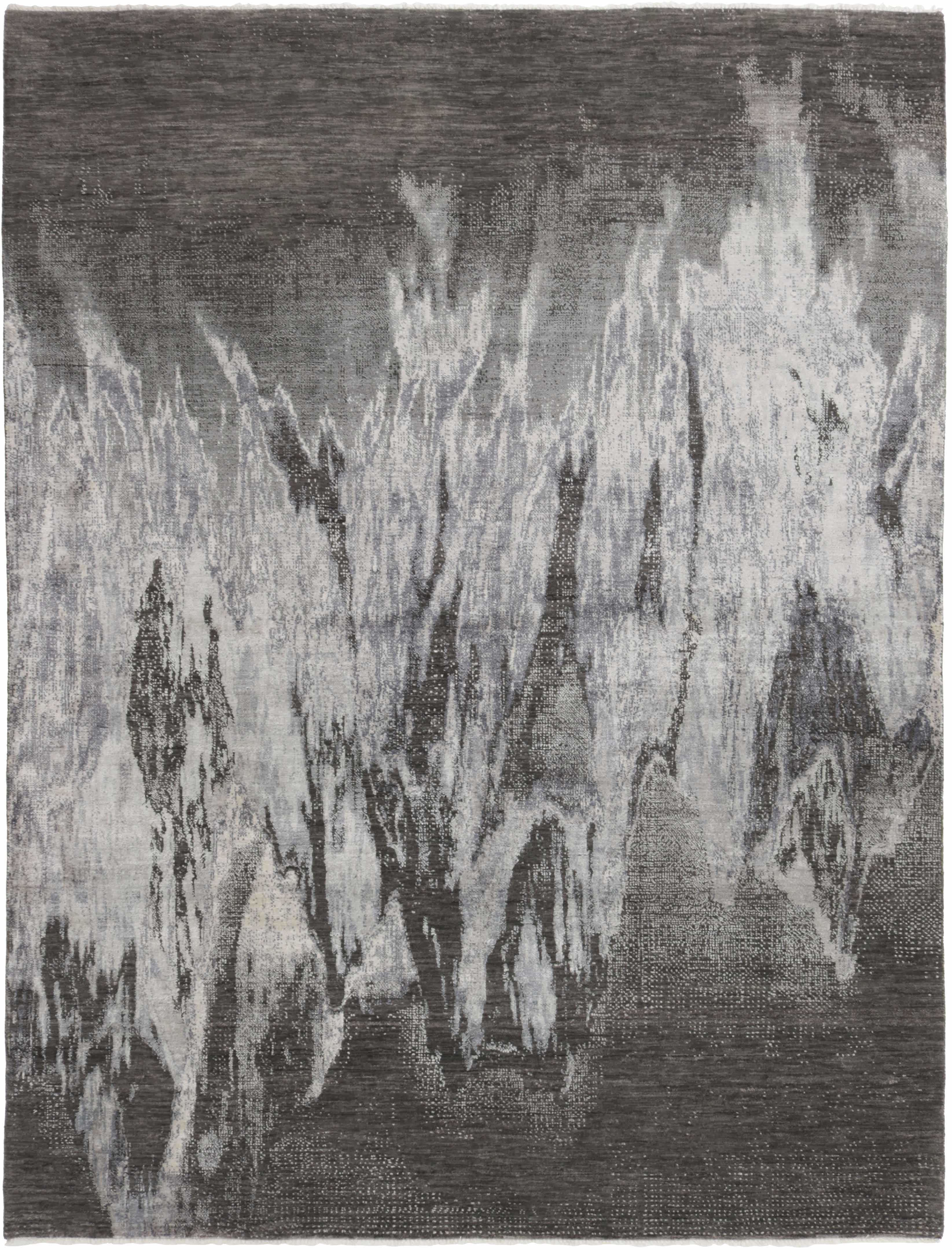 Area rug with abstract design in grey and beige