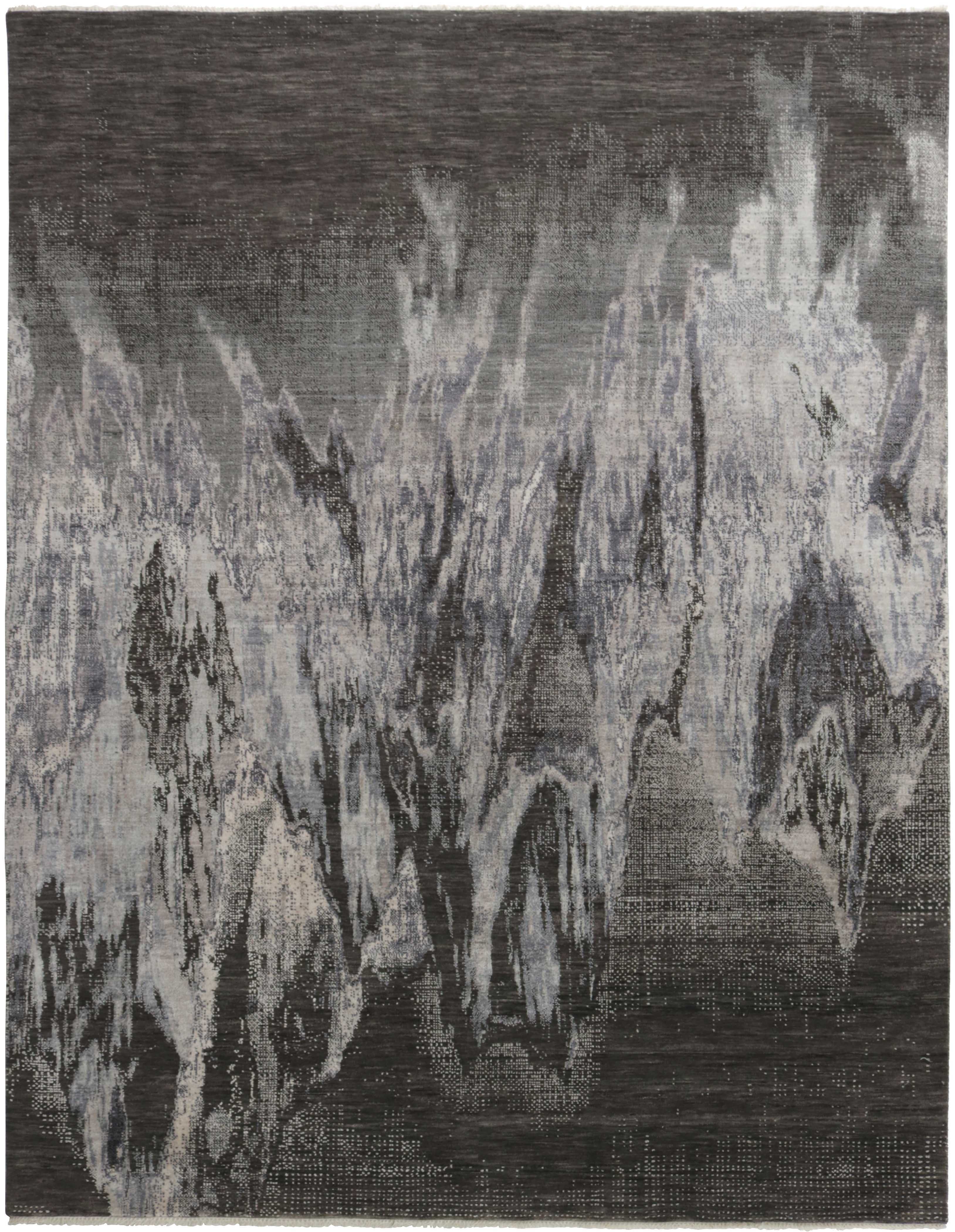 Area rug with abstract design in grey and beige