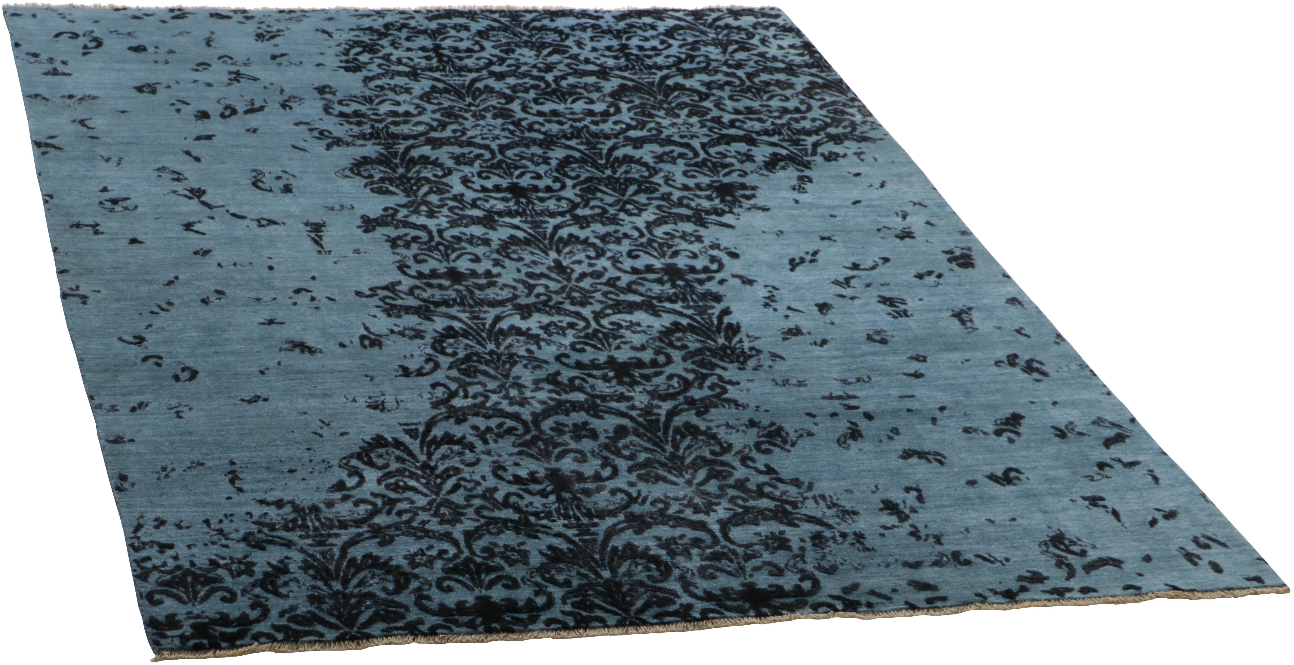 Authentic oriental rug with a damask pattern in blue