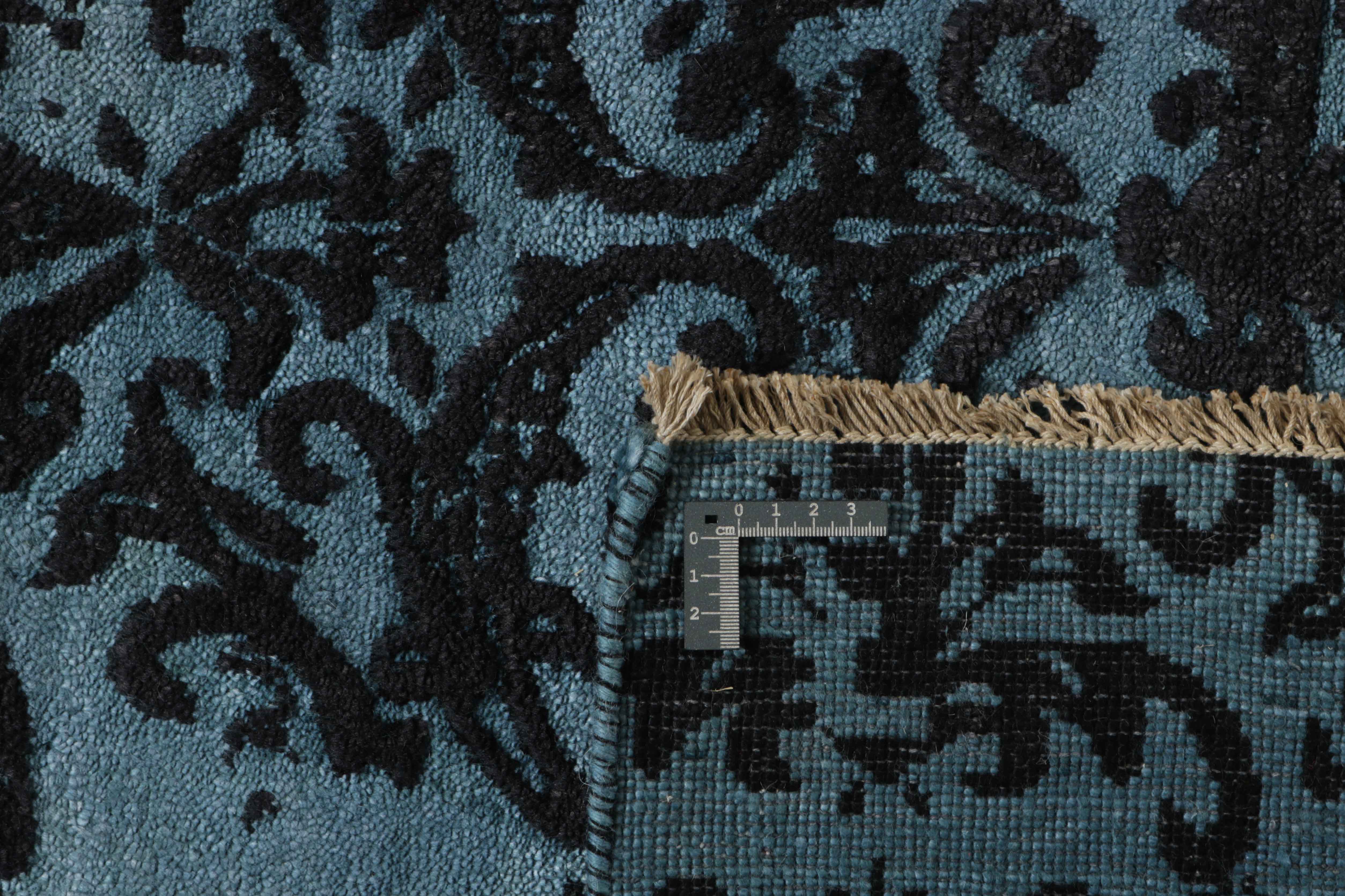 Authentic oriental rug with a damask pattern in blue and black